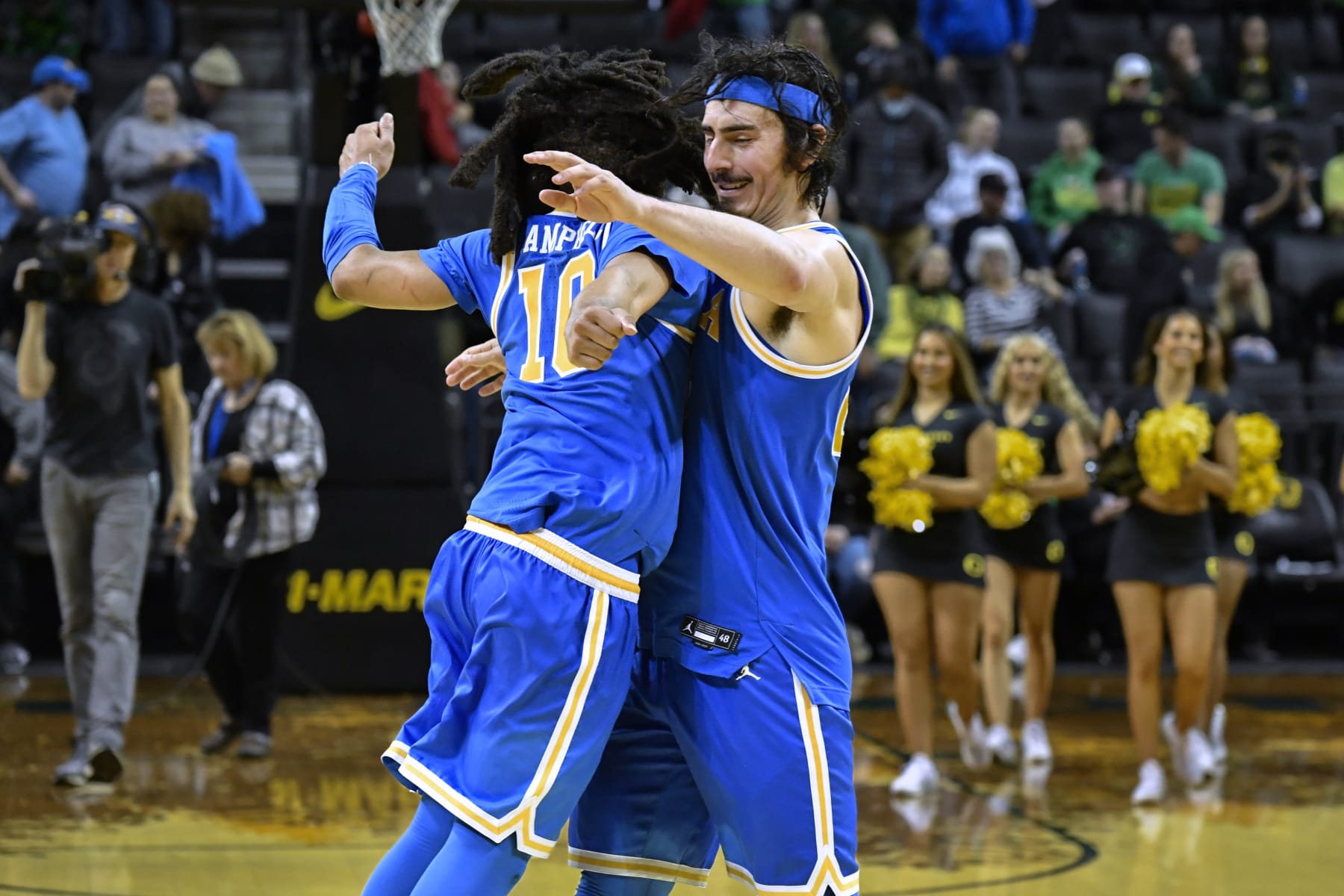 UCLA guard Tyger Campbell (10) and guard Jaime Jaquez Jr. celebrate after UCLA defeated Oregon 70-63 in an NCAA college basketball game Saturday, Feb. 11, 2023, in Eugene, Ore. (AP Photo/Andy Nelson)