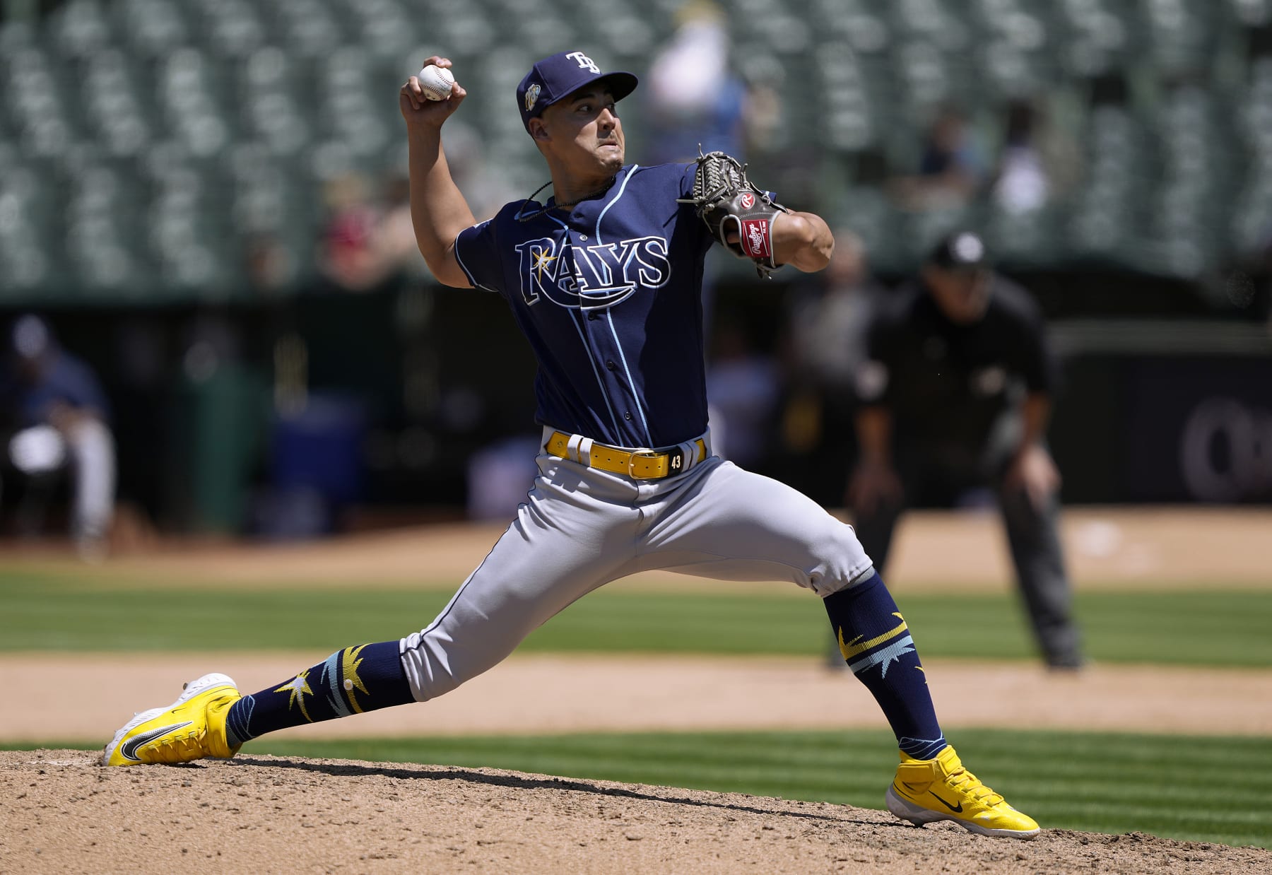 OAKLAND, CALIFORNIA - JUNE 15: Robert Stephenson #26 of the Tampa Bay Rays pitches against the Oakland Athletics in the bottom of the seventh inning of a major league baseball game at RingCentral Coliseum on June 15, 2023 in Oakland, California. (Photo by Thearon W. Henderson/Getty Images)