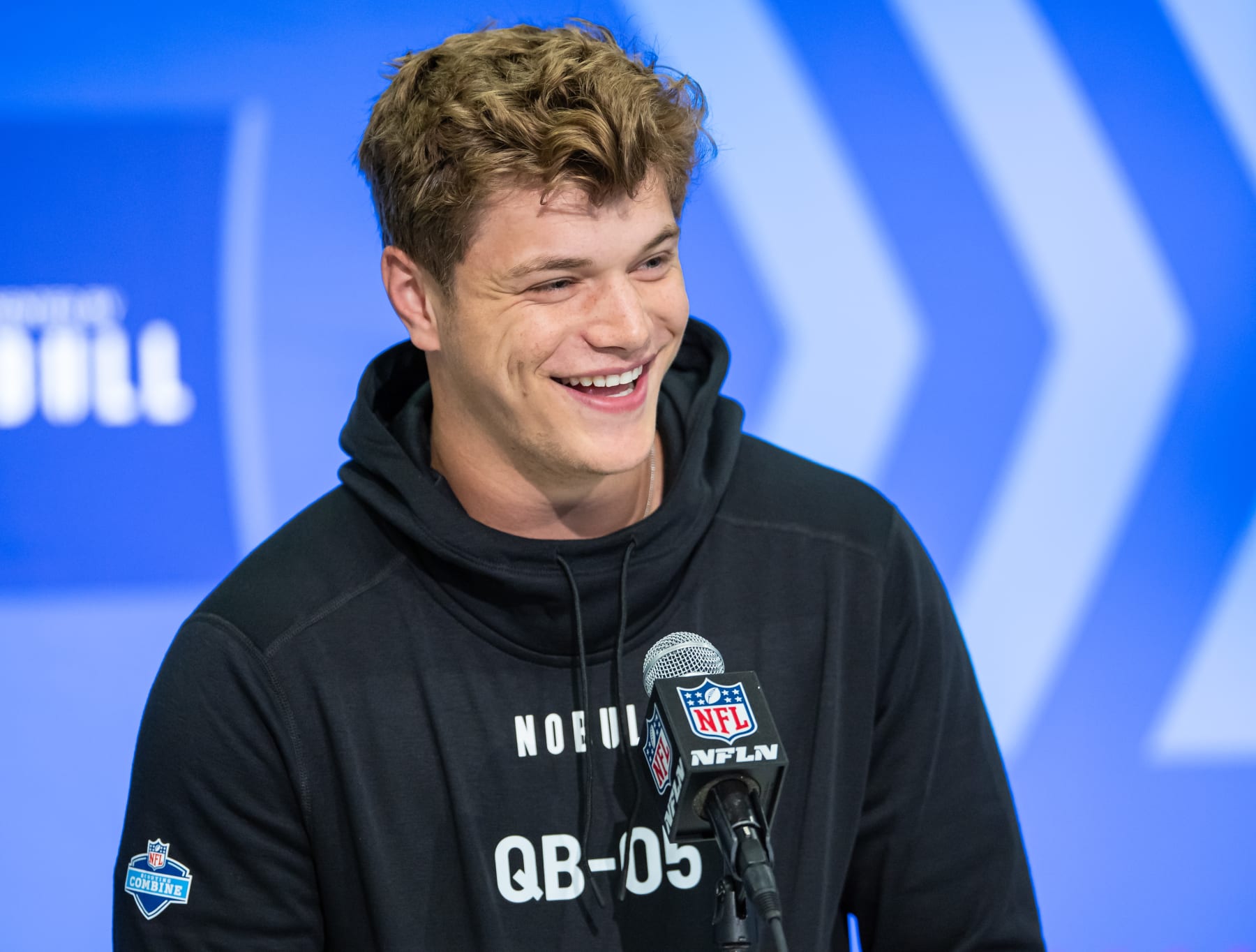 INDIANAPOLIS, INDIANA - MARCH 01: JJ McCarthy #QB05 of the Michigan Wolverines speaks to the media during the 2024 NFL Draft Combine at Lucas Oil Stadium on March 01, 2024 in Indianapolis, Indiana. (Photo by Michael Hickey/Getty Images)