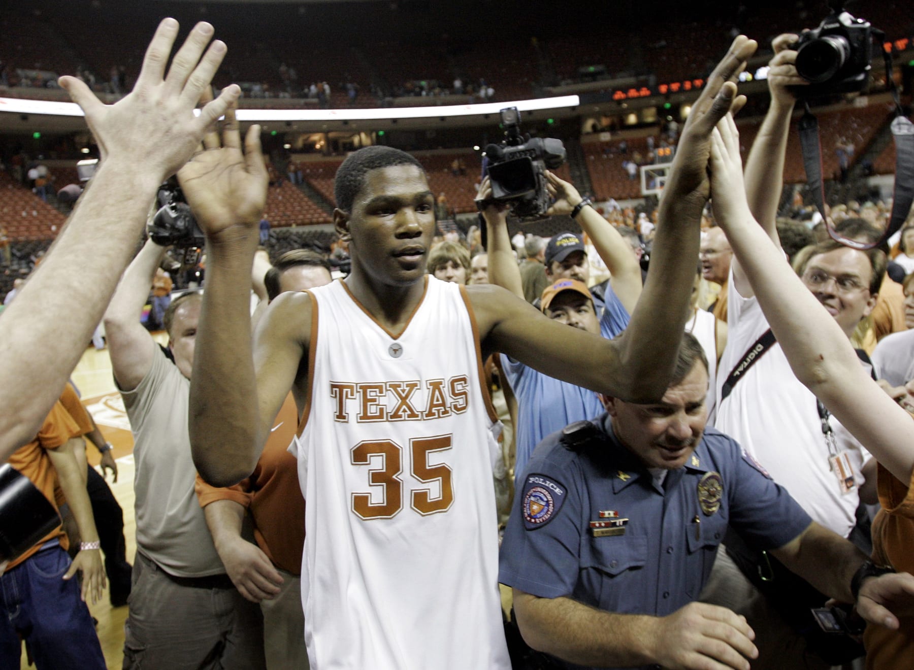 Texas forward Kevin Durant (35) celebrates with fans following the team's win over Texas A&M in Austin, Texas, Wednesday, Feb. 28, 2007. (AP Photo/Eric Gay)