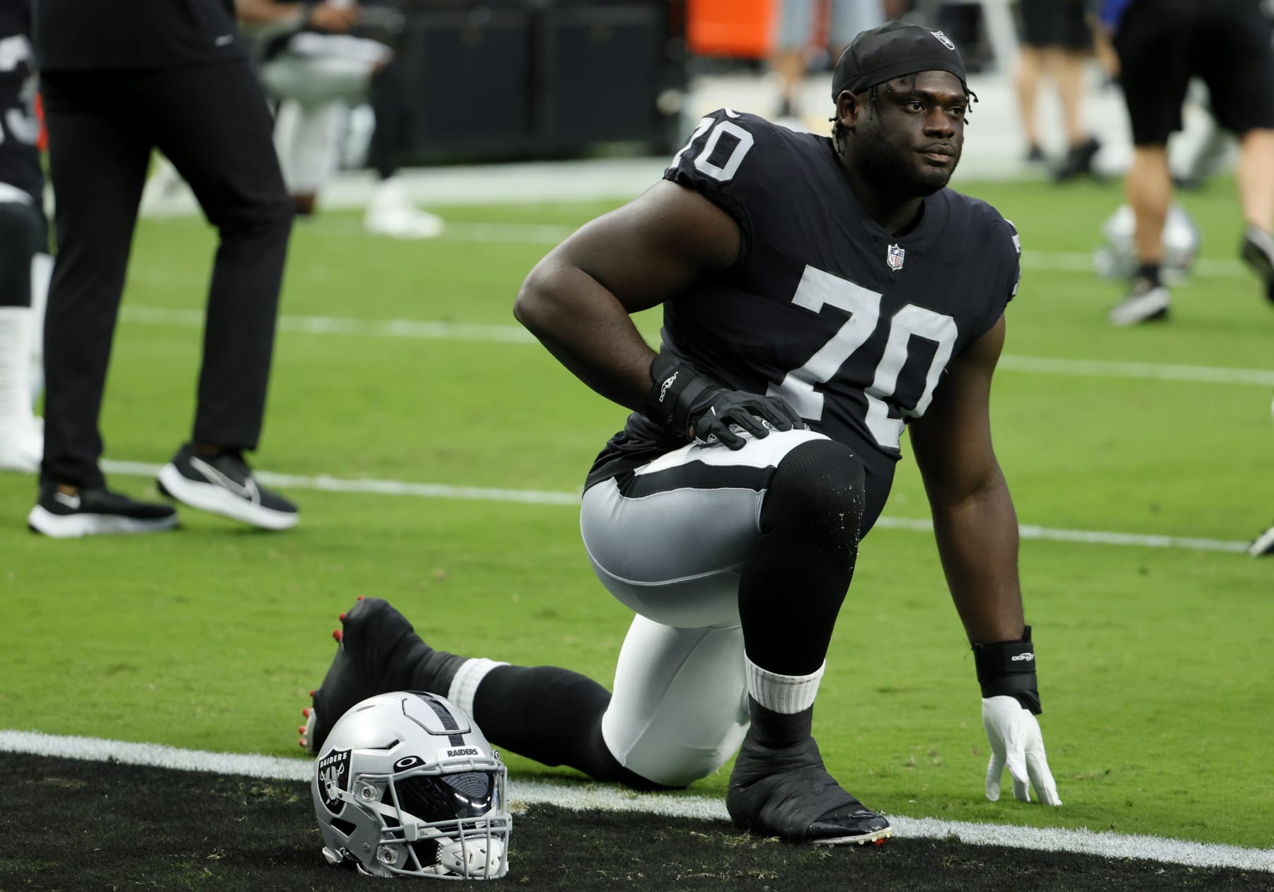 LAS VEGAS, NEVADA - SEPTEMBER 13: Alex Leatherwood #70 of the Las Vegas Raiders stretches before a game against the Baltimore Ravens at Allegiant Stadium on September 13, 2021 in Las Vegas, Nevada. (Photo by Ethan Miller/Getty Images)