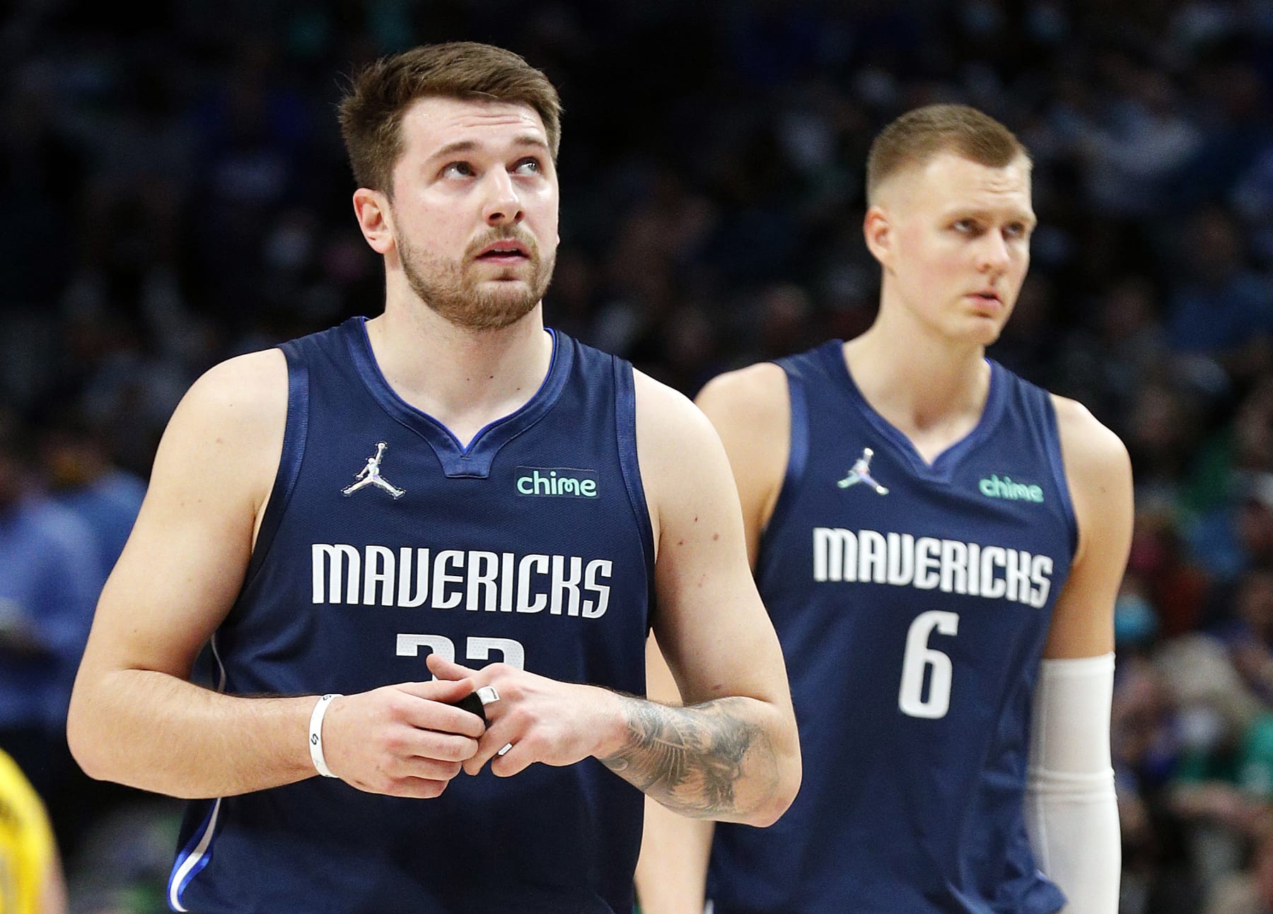 DALLAS, TEXAS - JANUARY 29: Luka Doncic #77 and Kristaps Porzingis #6 of the Dallas Mavericks are seen on the court against the Indiana Pacers at American Airlines Center on January 29, 2022 in Dallas, Texas. NOTE TO USER: User expressly acknowledges and agrees that,  by downloading and or using this photograph,  User is consenting to the terms and conditions of the Getty Images License Agreement. (Photo by Richard Rodriguez/Getty Images)