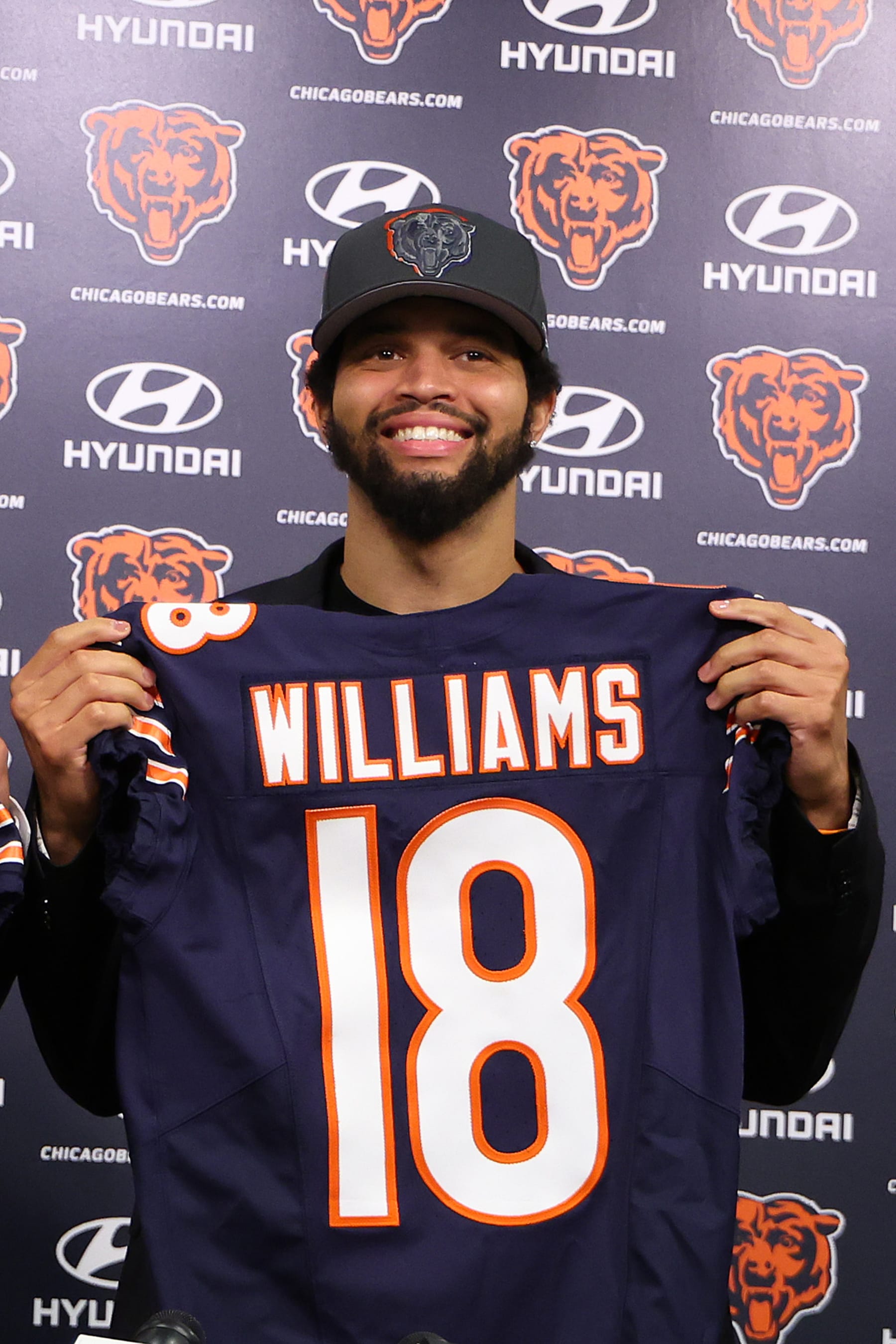 LAKE FOREST, ILLINOIS - APRIL 26: Caleb Williams #18 of the Chicago Bears poses for a photo during his introductory press conference after being drafted first overall in the 2024 NFL Draft Thursday at Halas Hall on April 26, 2024 in Lake Forest, Illinois. (Photo by Michael Reaves/Getty Images)