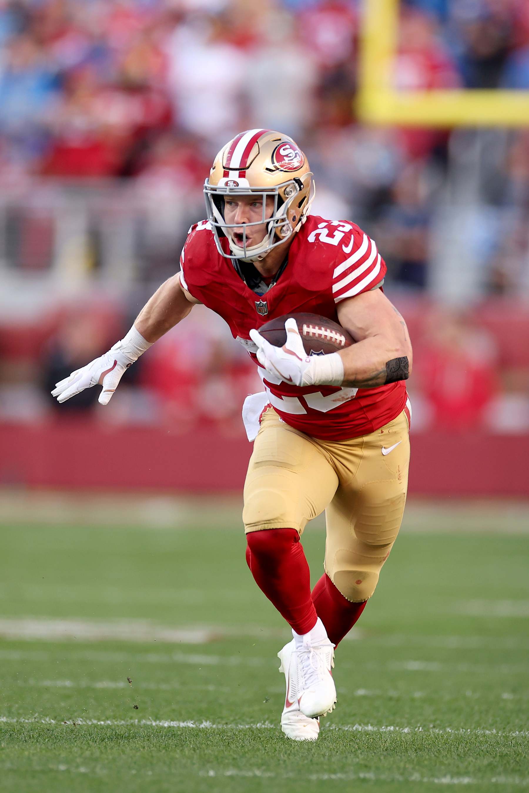 SANTA CLARA, CALIFORNIA - JANUARY 28: Christian McCaffrey #23 of the San Francisco 49ers runs with the ball against the Detroit Lions in the NFC Championship Game at Levi's Stadium on January 28, 2024 in Santa Clara, California. (Photo by Ezra Shaw/Getty Images)