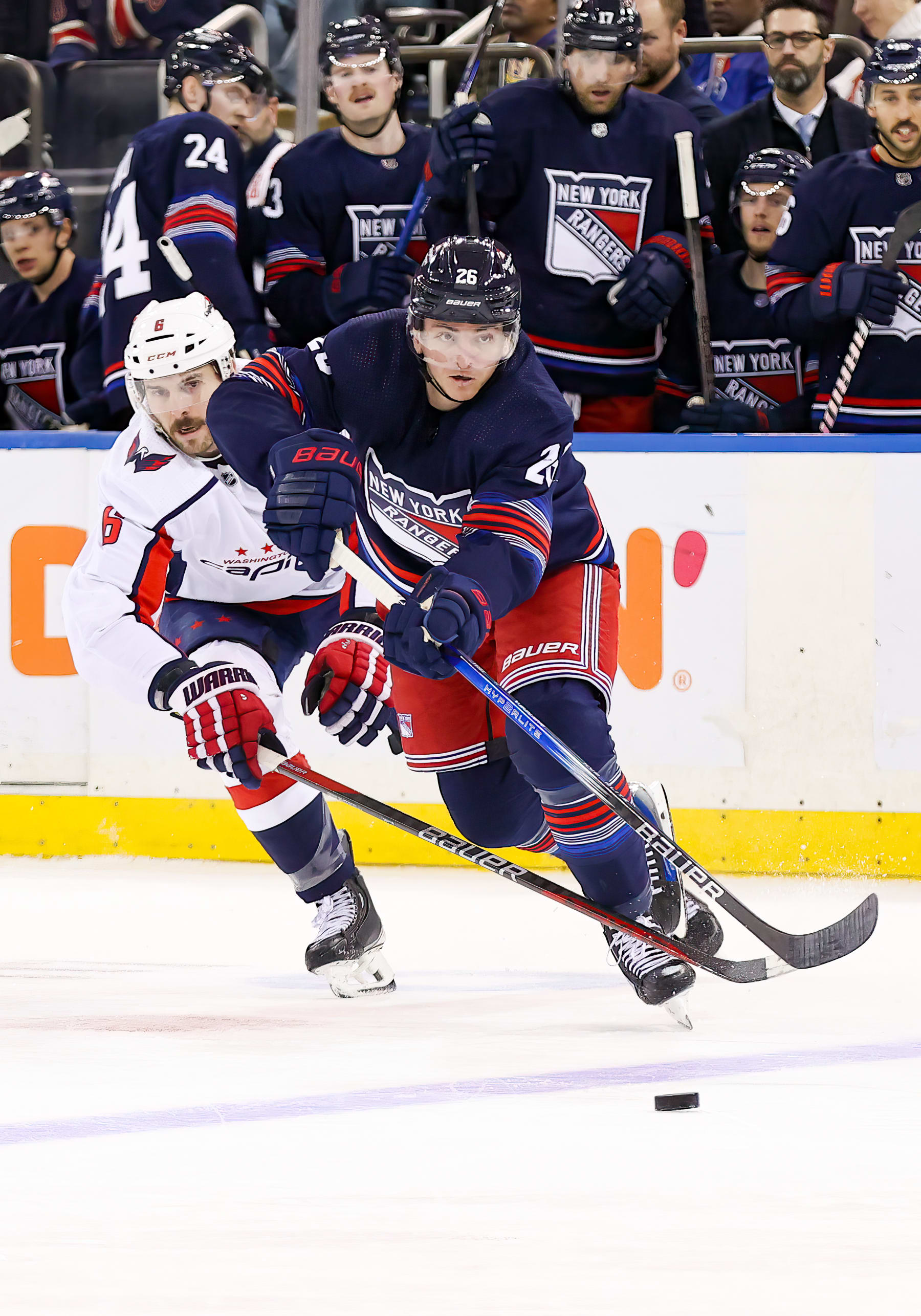 NEW YORK, NY - JANUARY 14: New York Rangers Left Wing Jimmy Vesey (26) skates against Washington Capitals Defenseman Joel Edmundson (6) during the National Hockey League game between the Washington Capitals and the New York Rangers on January 14, 2024 at Madison Square Garden in New York, NY. (Photo by Joshua Sarner/Icon Sportswire via Getty Images)