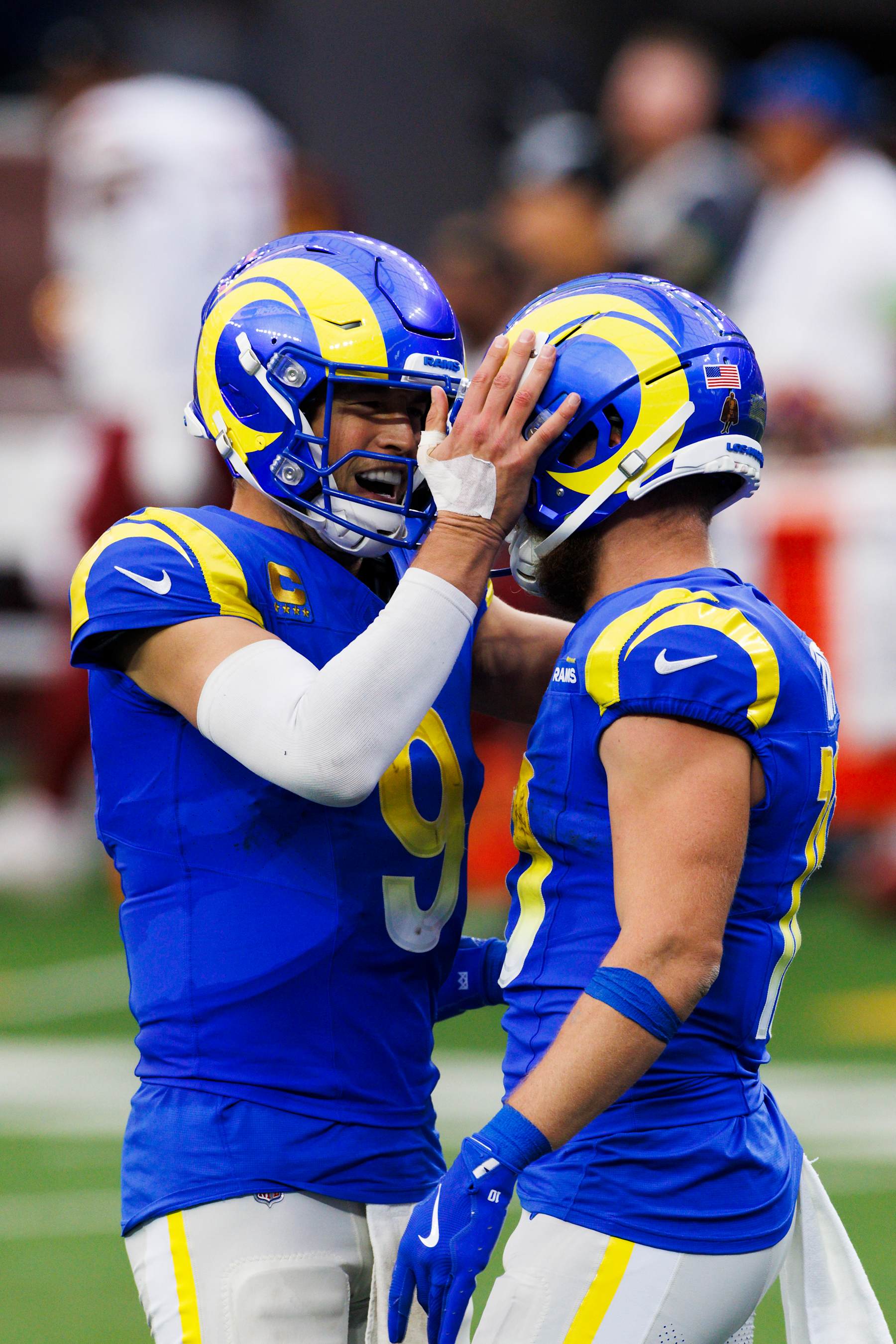 INGLEWOOD, CALIFORNIA - DECEMBER 17: Matthew Stafford #9 of the Los Angeles Rams celebrates with Cooper Kupp #10 of the Los Angeles Rams during a game against the Washington Commanders at SoFi Stadium on December 17, 2023 in Inglewood, California. (Photo by Ric Tapia/Getty Images)