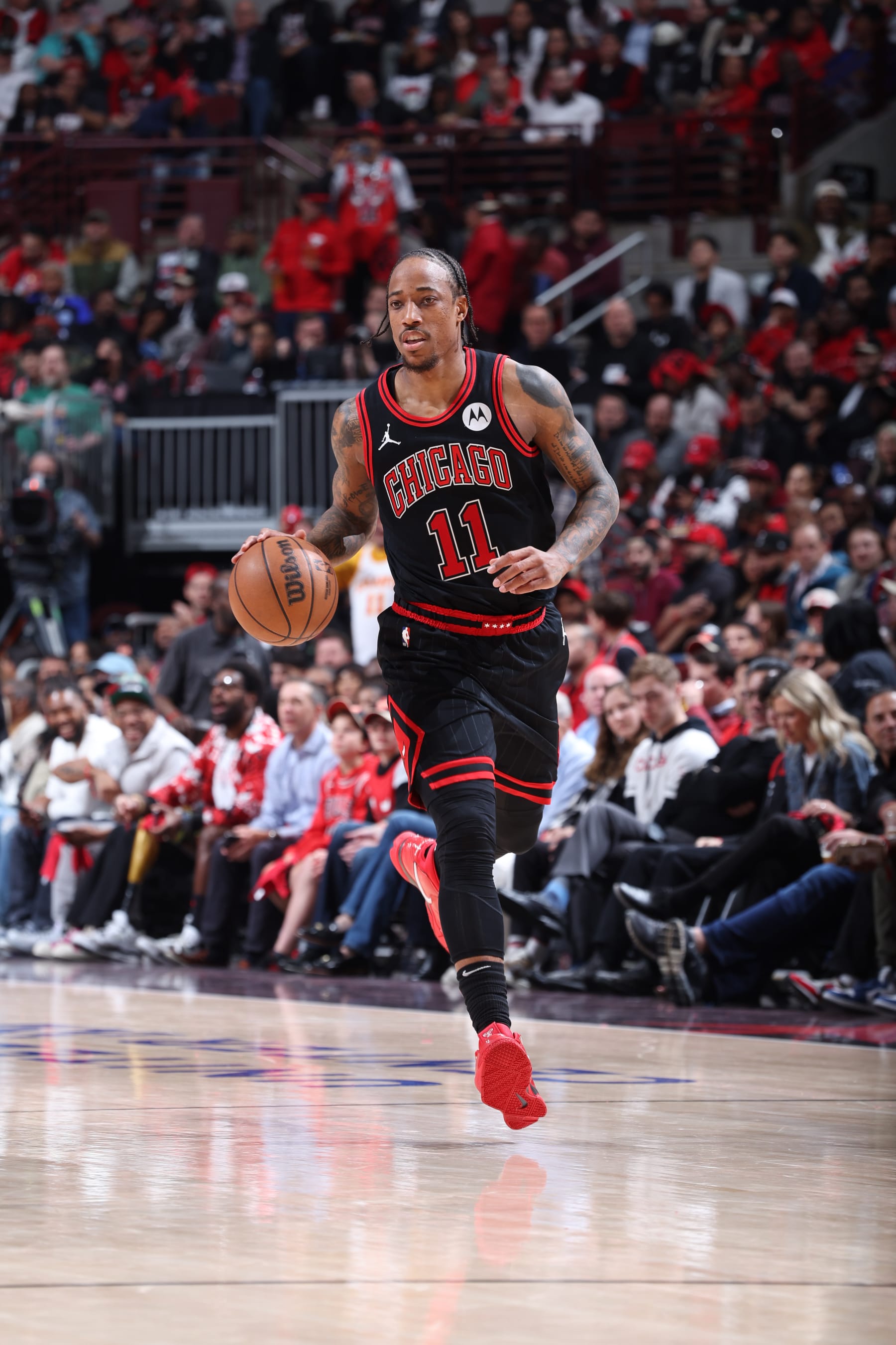 CHICAGO, IL - APRIL 17:  DeMar DeRozan #11 of the Chicago Bulls handles the ball during the game against the Atlanta Hawks during the 2024 Play-In Tournament  on April 17, 2024 at United Center in Chicago, Illinois. NOTE TO USER: User expressly acknowledges and agrees that, by downloading and or using this photograph, User is consenting to the terms and conditions of the Getty Images License Agreement. Mandatory Copyright Notice: Copyright 2024 NBAE (Photo by Jeff Haynes/NBAE via Getty Images)