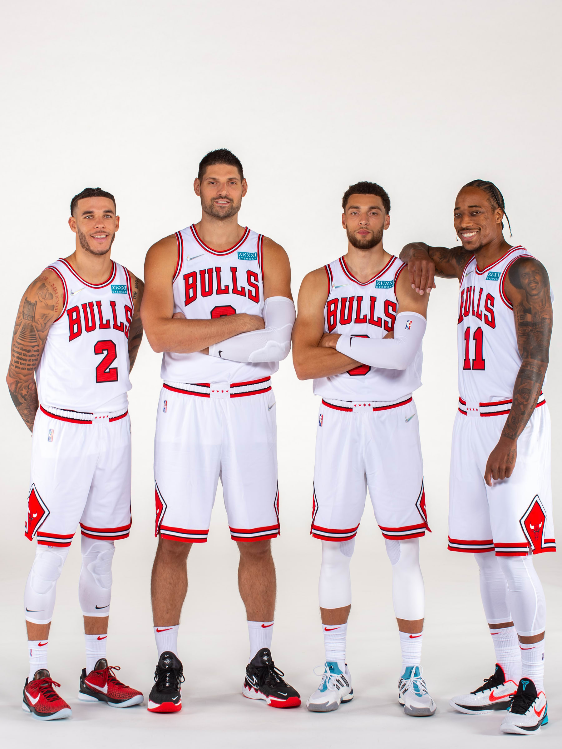 CHICAGO, IL - SEPTEMBER 27: Lonzo Ball #2, Nikola Vucevic #9, Zach LaVine #8, and DeMar DeRozan #11 of the Chicago Bulls pose for a portrait during NBA Media Day on September 27, 2021 at the United Center in Chicago, Illinois. NOTE TO USER: User expressly acknowledges and agrees that, by downloading and/or using this photograph, user is consenting to the terms and conditions of the Getty Images License Agreement.  Mandatory Copyright Notice: Copyright 2021 NBAE (Photo by Randy Belice/NBAE via Getty Images)