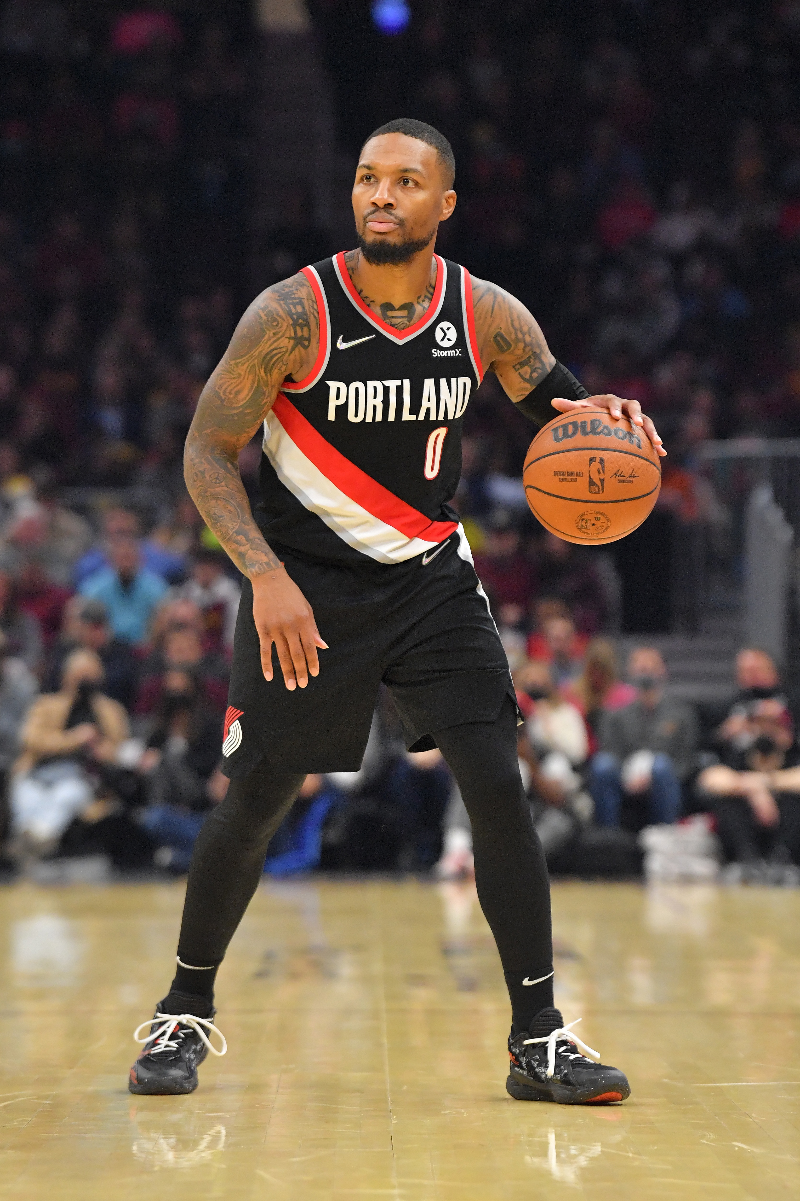 CLEVELAND, OHIO - NOVEMBER 03: Damian Lillard #0 of the Portland Trail Blazers brings the ball up court during the first half against the Cleveland Cavaliers at Rocket Mortgage Fieldhouse on November 03, 2021 in Cleveland, Ohio. NOTE TO USER: User expressly acknowledges and agrees that, by downloading and/or using this photograph, user is consenting to the terms and conditions of the Getty Images License Agreement. (Photo by Jason Miller/Getty Images)