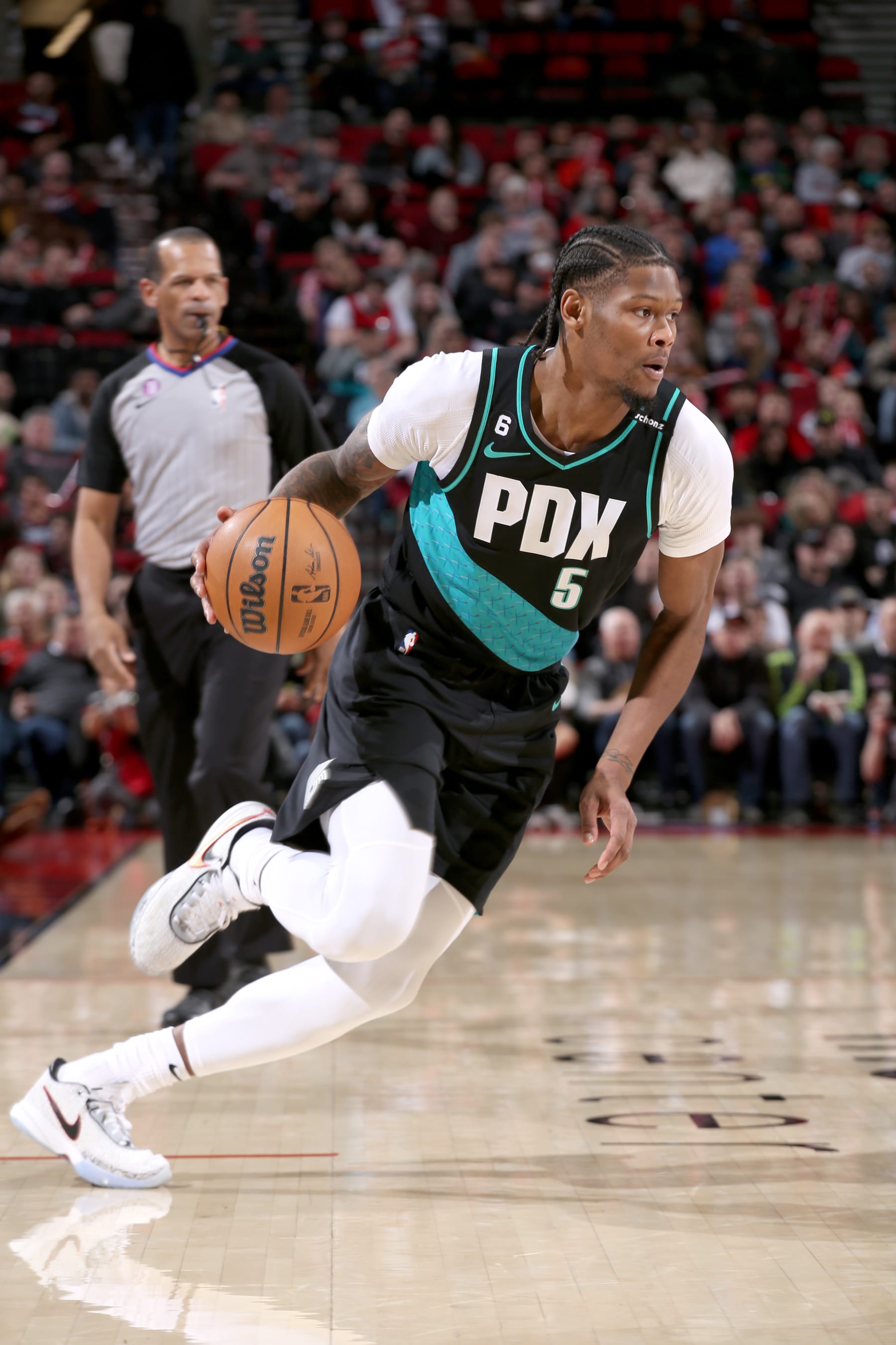 PORTLAND, OR - MARCH 27:  Cam Reddish #5 of the Portland Trail Blazers dribbles the ball against the New Orleans Pelicans on March 27, 2023 at the Moda Center Arena in Portland, Oregon. NOTE TO USER: User expressly acknowledges and agrees that, by downloading and or using this photograph, user is consenting to the terms and conditions of the Getty Images License Agreement. Mandatory Copyright Notice: Copyright 2023 NBAE (Photo by Cameron Browne/NBAE via Getty Images)