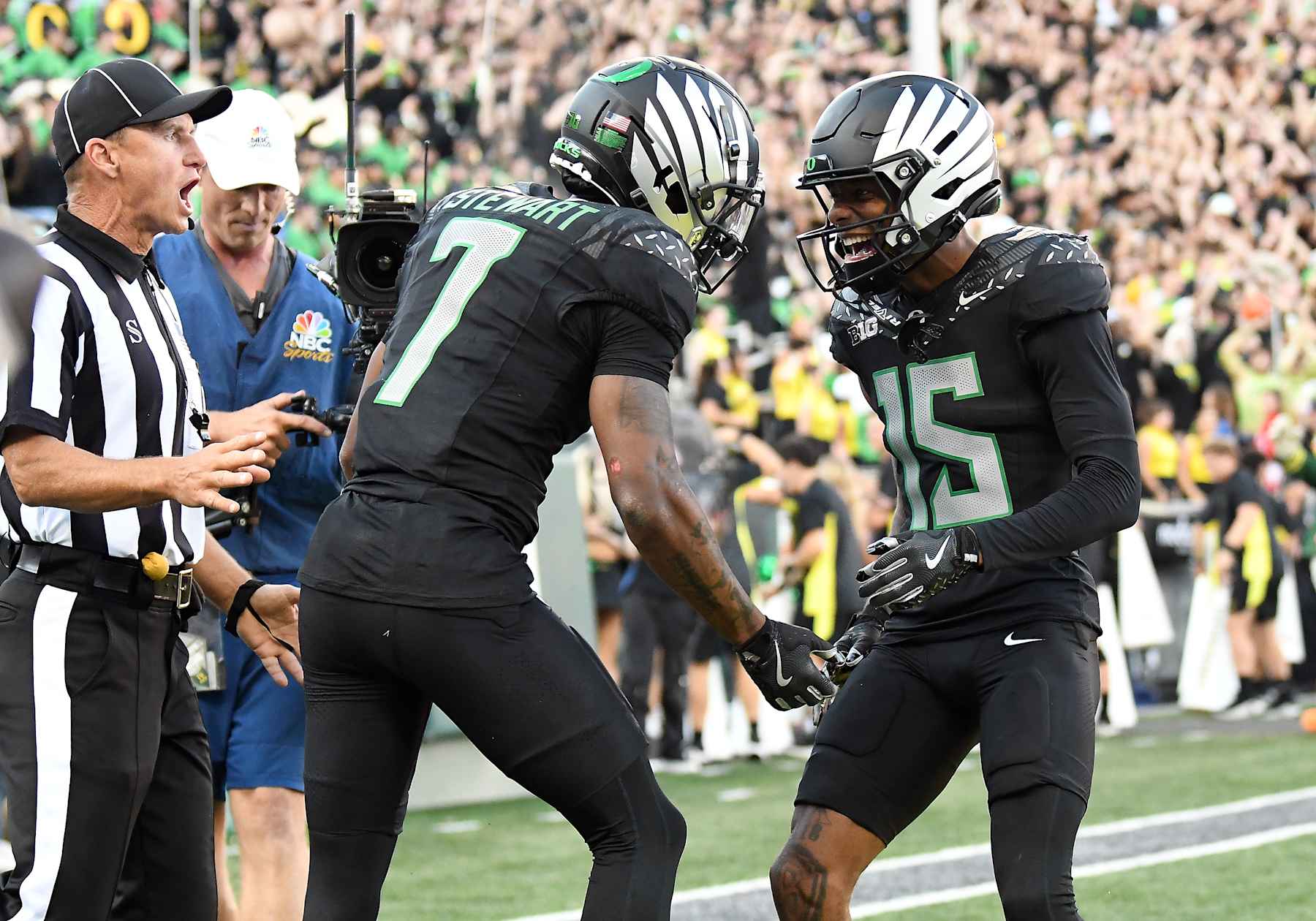 EUGENE, OR - OCTOBER 12: Oregon Ducks wide receiver Tez Johnson (15) celebrates a touchdown by Oregon Ducks wide receiver Evan Stewart (7) in the second quarter during a college football game between the Ohio State Buckeyes and Oregon Ducks on October 12, 2024, at Autzen Stadium in Eugene, Oregon.(Photo by Brian Murphy/Icon Sportswire via Getty Images)