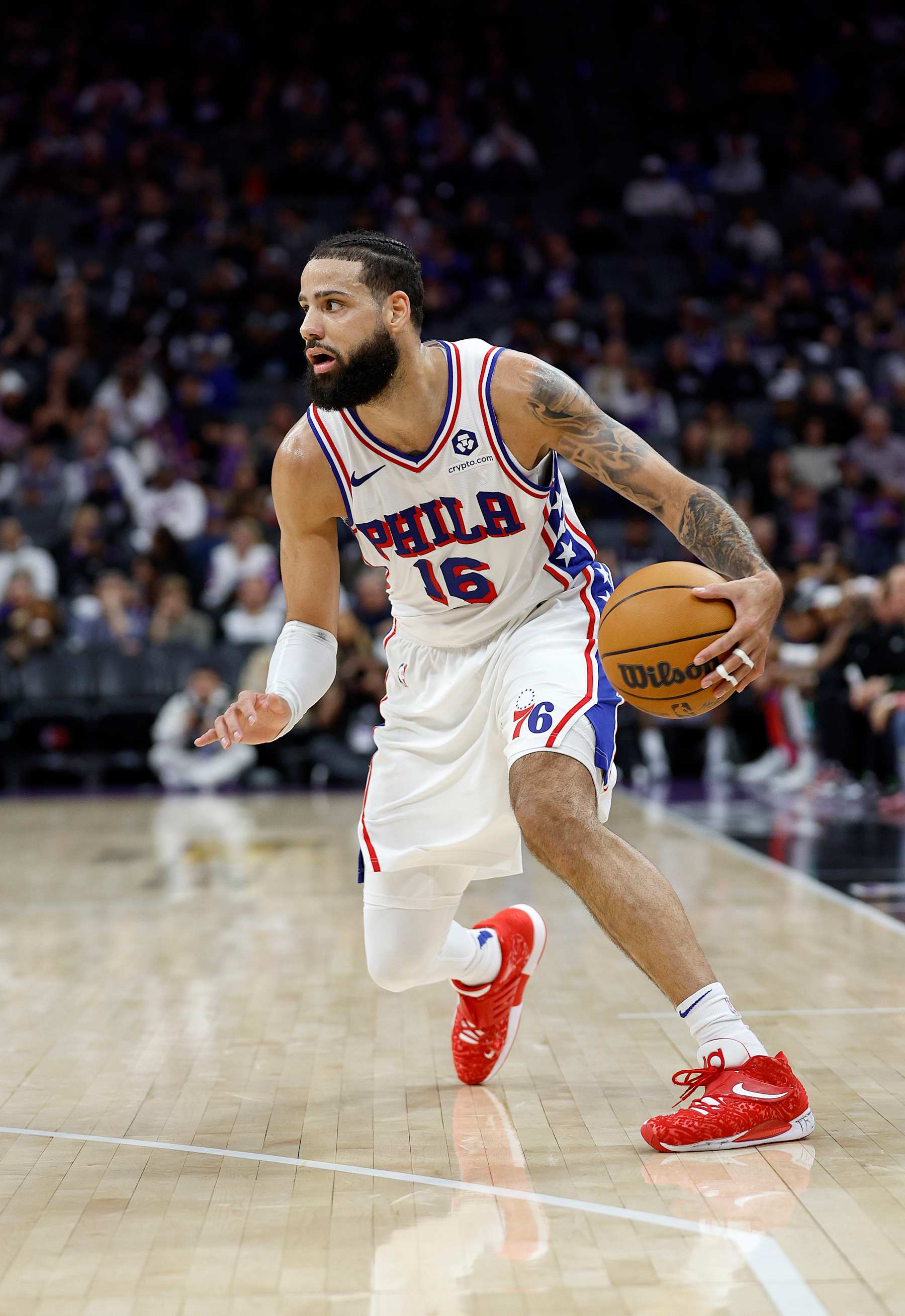 SACRAMENTO, CALIFORNIA - JANUARY 01: Caleb Martin #16 of the Philadelphia 76ers dribbling the ball against the Sacramento Kings during the second half of an NBA basketball game at Golden 1 Center on January 01, 2025 in Sacramento, California. NOTE TO USER: User expressly acknowledges and agrees that, by downloading and or using this photograph, User is consenting to the terms and conditions of the Getty Images License Agreement. (Photo by Thearon W. Henderson/Getty Images)