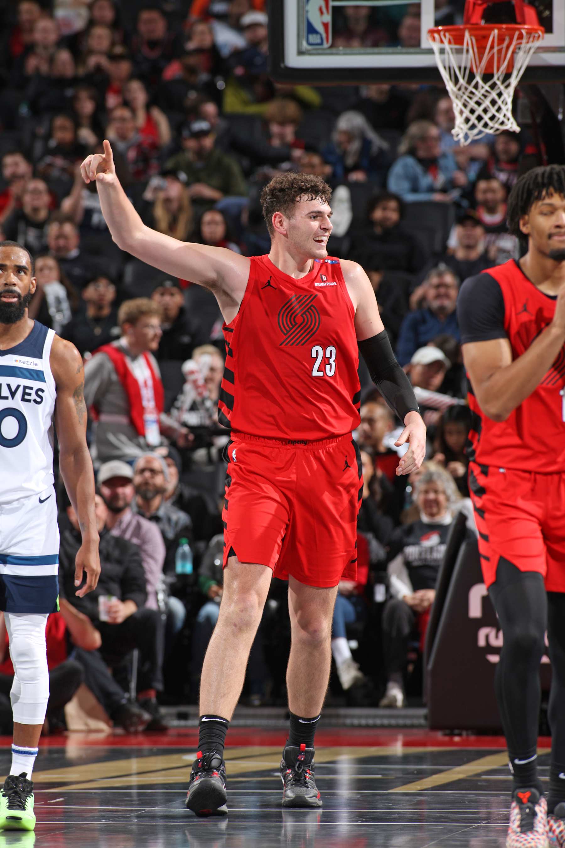 PORTLAND, OR - NOVEMBER 12: Donovan Clingan #23 of the Portland Trail Blazers celebrates during the game against the Minnesota Timberwolves during the Emirates NBA Cup game on November 12, 2024 at the Moda Center Arena in Portland, Oregon. NOTE TO USER: User expressly acknowledges and agrees that, by downloading and or using this photograph, user is consenting to the terms and conditions of the Getty Images License Agreement. Mandatory Copyright Notice: Copyright 2024 NBAE (Photo by Cameron Browne/NBAE via Getty Images)