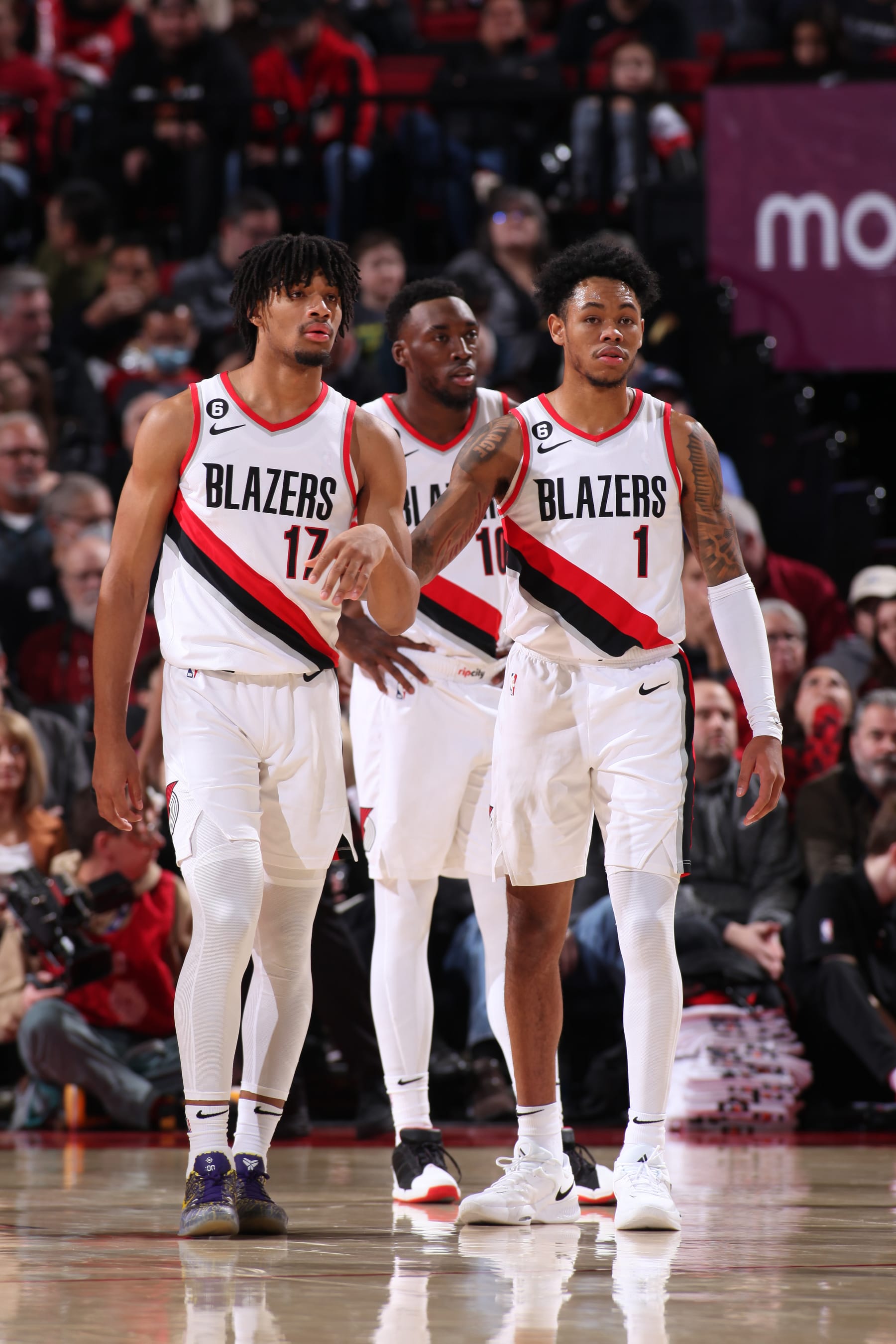 PORTLAND, OR - NOVEMBER 19: Shaedon Sharpe #17 and Anfernee Simons #1 of the Portland Trail Blazers walk on the court against the Utah Jazz on November 19, 2022 at the Moda Center Arena in Portland, Oregon. NOTE TO USER: User expressly acknowledges and agrees that, by downloading and or using this photograph, user is consenting to the terms and conditions of the Getty Images License Agreement. Mandatory Copyright Notice: Copyright 2022 NBAE (Photo by Cameron Browne/NBAE via Getty Images)