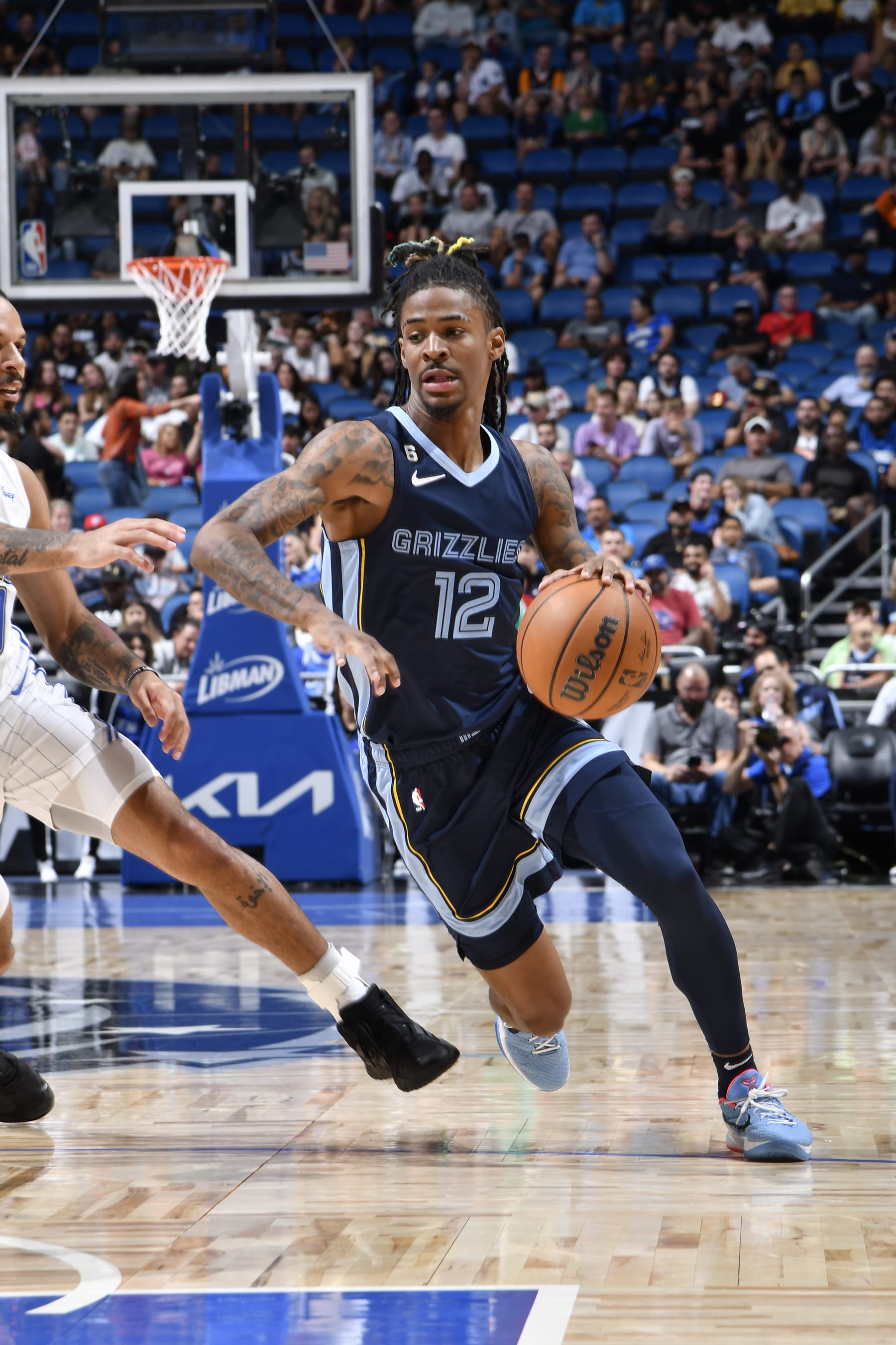 ORLANDO, FL - OCTOBER 11: Ja Morant #12 of the Memphis Grizzlies drives to the basket during the game against the Orlando Magic on October 11, 2022 at Amway Center in Orlando, Florida. NOTE TO USER: User expressly acknowledges and agrees that, by downloading and or using this photograph, User is consenting to the terms and conditions of the Getty Images License Agreement. Mandatory Copyright Notice: Copyright 2022 NBAE (Photo by Fernando Medina/NBAE via Getty Images)