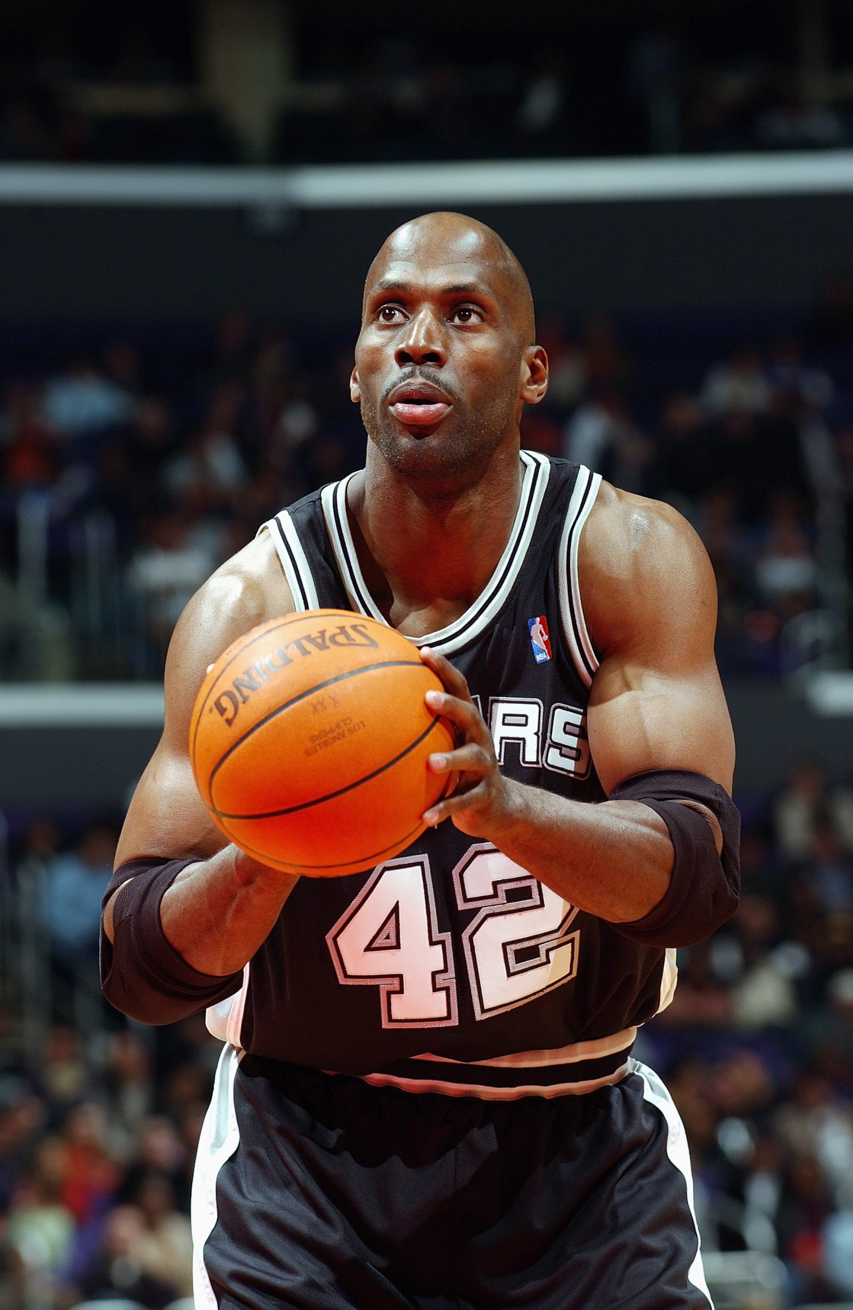 LOS ANGELES - DECEMBER 1:  Kevin Willis #42 of the San Antonio Spurs shoots a free throw during the game against the Los Angeles Clippers at the Staples Center on December 1, 2003 in Los Angeles, California. The Clippers won 91-83.  NOTE TO USER: User expressly acknowledges and agrees that, by downloading and/or using this Photograph, User is consenting to the terms and conditions of the Getty Images License Agreement.  (Photo by Andrew D. Bernstein/NBAE via Getty Images)