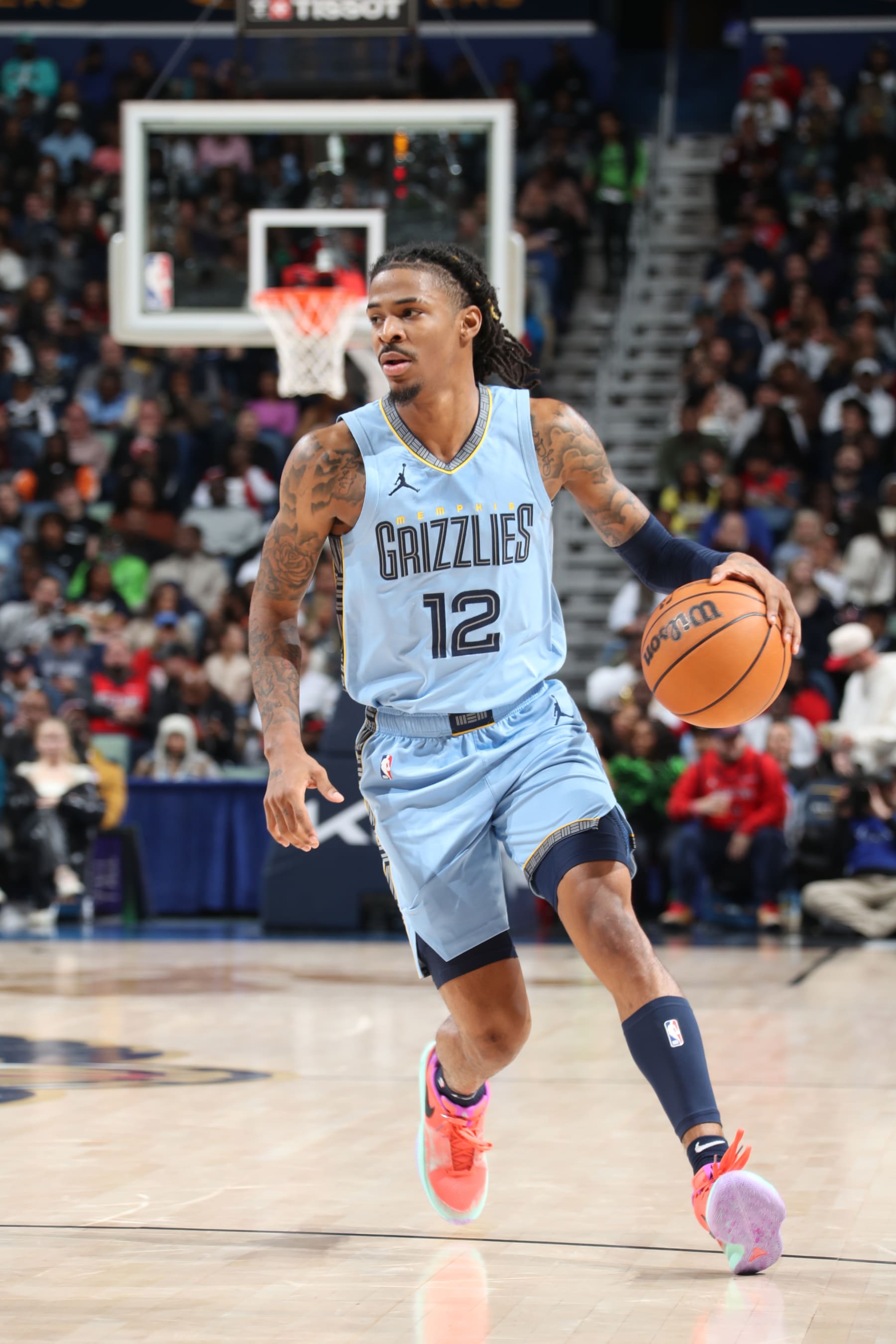 NEW ORLEANS, LA - DECEMBER 26: Ja Morant #12 of the Memphis Grizzlies dribbles the ball during the game against the New Orleans Pelicans on December 26, 2023 at the Smoothie King Center in New Orleans, Louisiana. NOTE TO USER: User expressly acknowledges and agrees that, by downloading and or using this Photograph, user is consenting to the terms and conditions of the Getty Images License Agreement. Mandatory Copyright Notice: Copyright 2023 NBAE (Photo by Layne Murdoch Jr./NBAE via Getty Images)