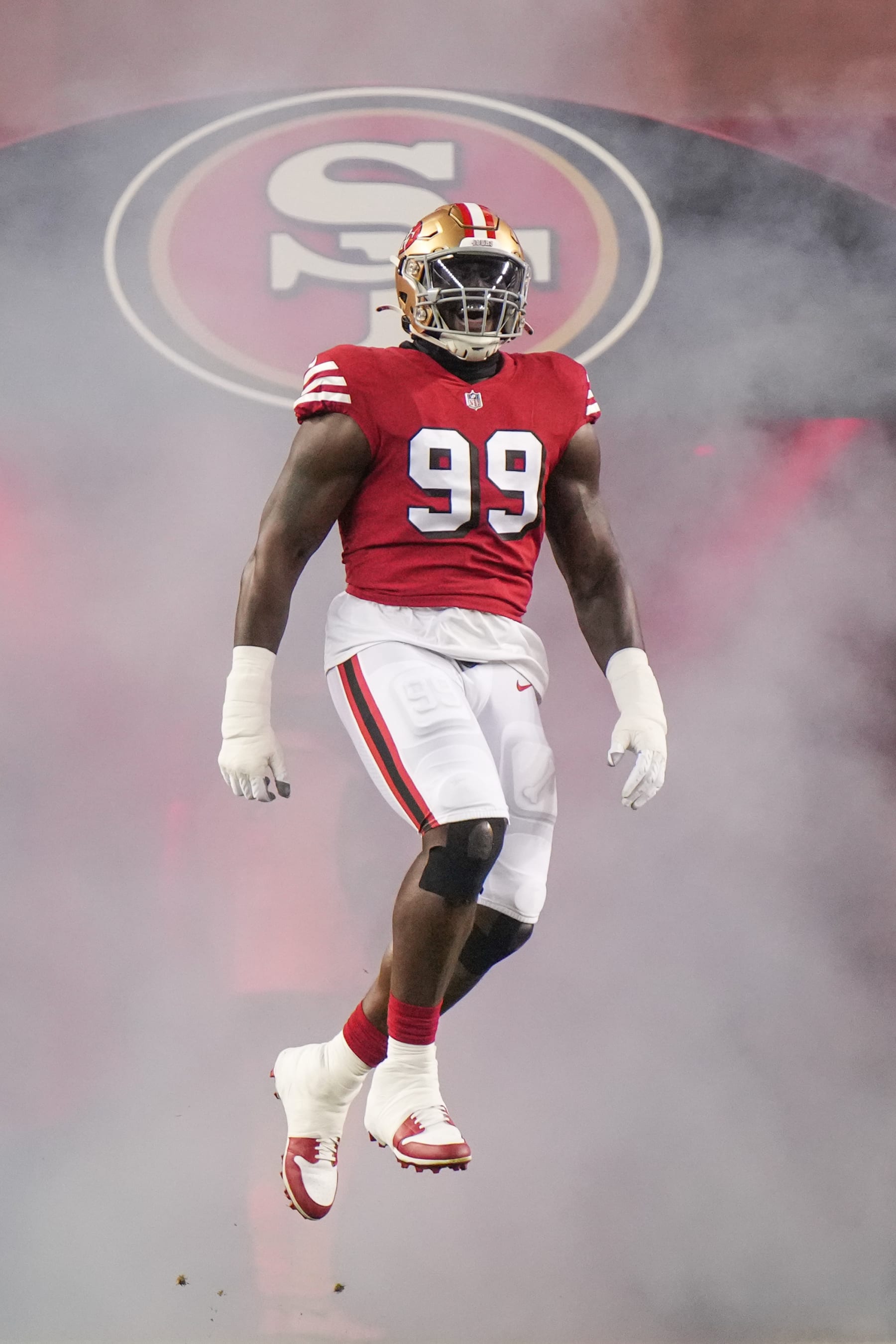 SANTA CLARA, CALIFORNIA - DECEMBER 25: Javon Kinlaw #99 of the San Francisco 49ers runs onto the field before playing the Baltimore Ravens at Levi's Stadium on December 25, 2023 in Santa Clara, California. (Photo by Loren Elliott/Getty Images)