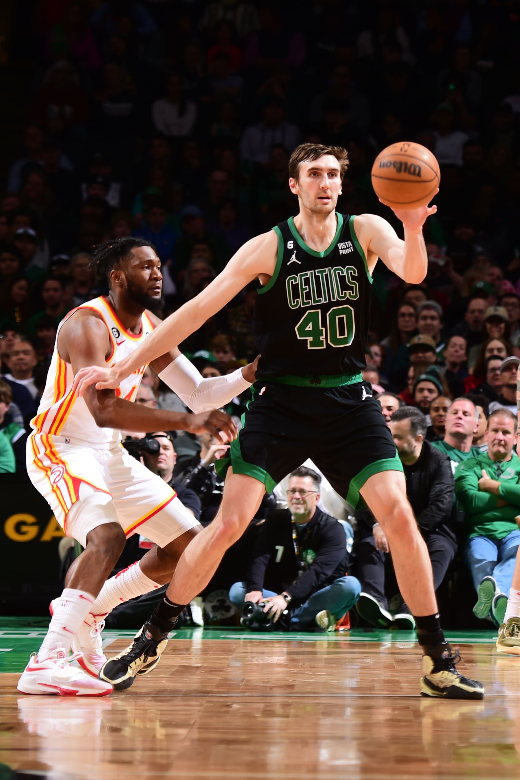 BOSTON, MA - APRIL 9: Luke Kornet #40 of the Boston Celtics passes the ball during the game against the Atlanta Hawks on April 9, 2023 at the TD Garden in Boston, Massachusetts. NOTE TO USER: User expressly acknowledges and agrees that, by downloading and or using this photograph, User is consenting to the terms and conditions of the Getty Images License Agreement. Mandatory Copyright Notice: Copyright 2023 NBAE  (Photo by Brian Babineau/NBAE via Getty Images)