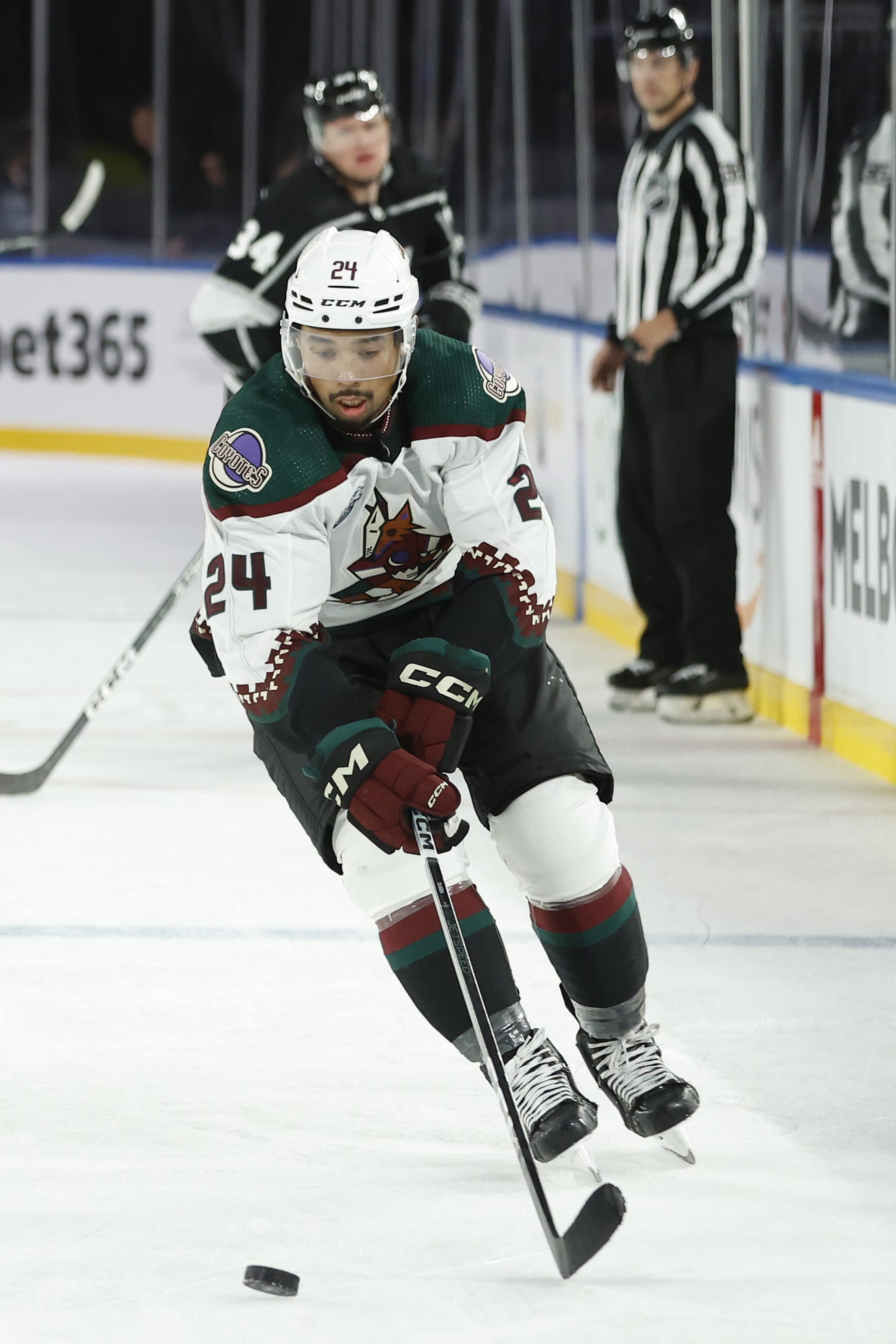 MELBOURNE, AUSTRALIA - SEPTEMBER 24: Matt Dumba of the Arizona Coyotes controls the puck during the NHL Global Series match between Arizona Coyotes and Los Angeles Kings at Rod Laver Arena on September 24, 2023 in Melbourne, Australia. (Photo by Darrian Traynor/Getty Images)
