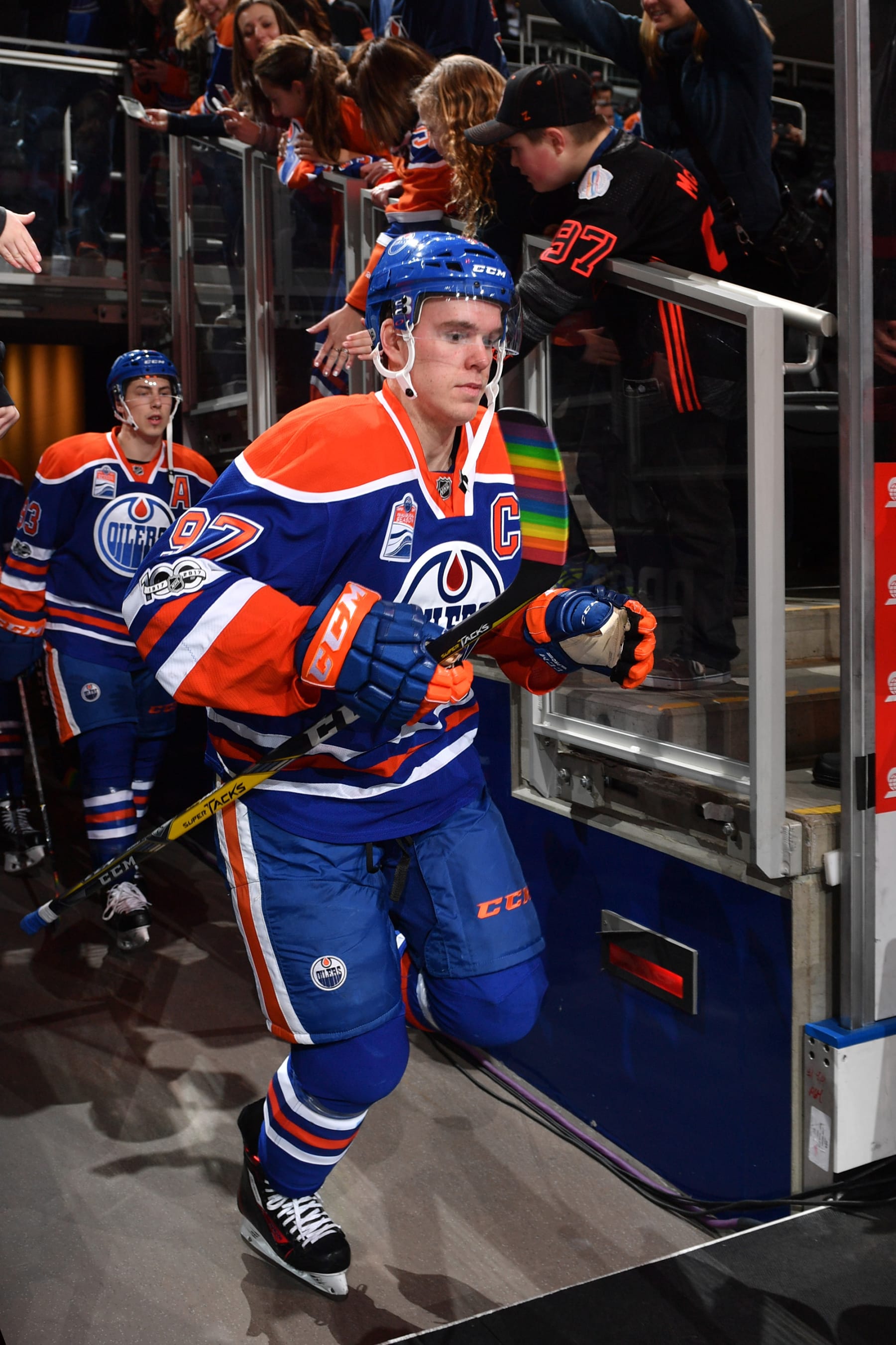 EDMONTON, AB - FEBRUARY 14: Connor McDavid #97 of the Edmonton Oilers carries his stick with Pride Tape goes on to the ice for warm up before the game against the Arizona Coyotes on You Can Play Night, February 14, 2017 at Rogers Place in Edmonton, Alberta, Canada. (Photo by Andy Devlin/NHLI via Getty Images) 