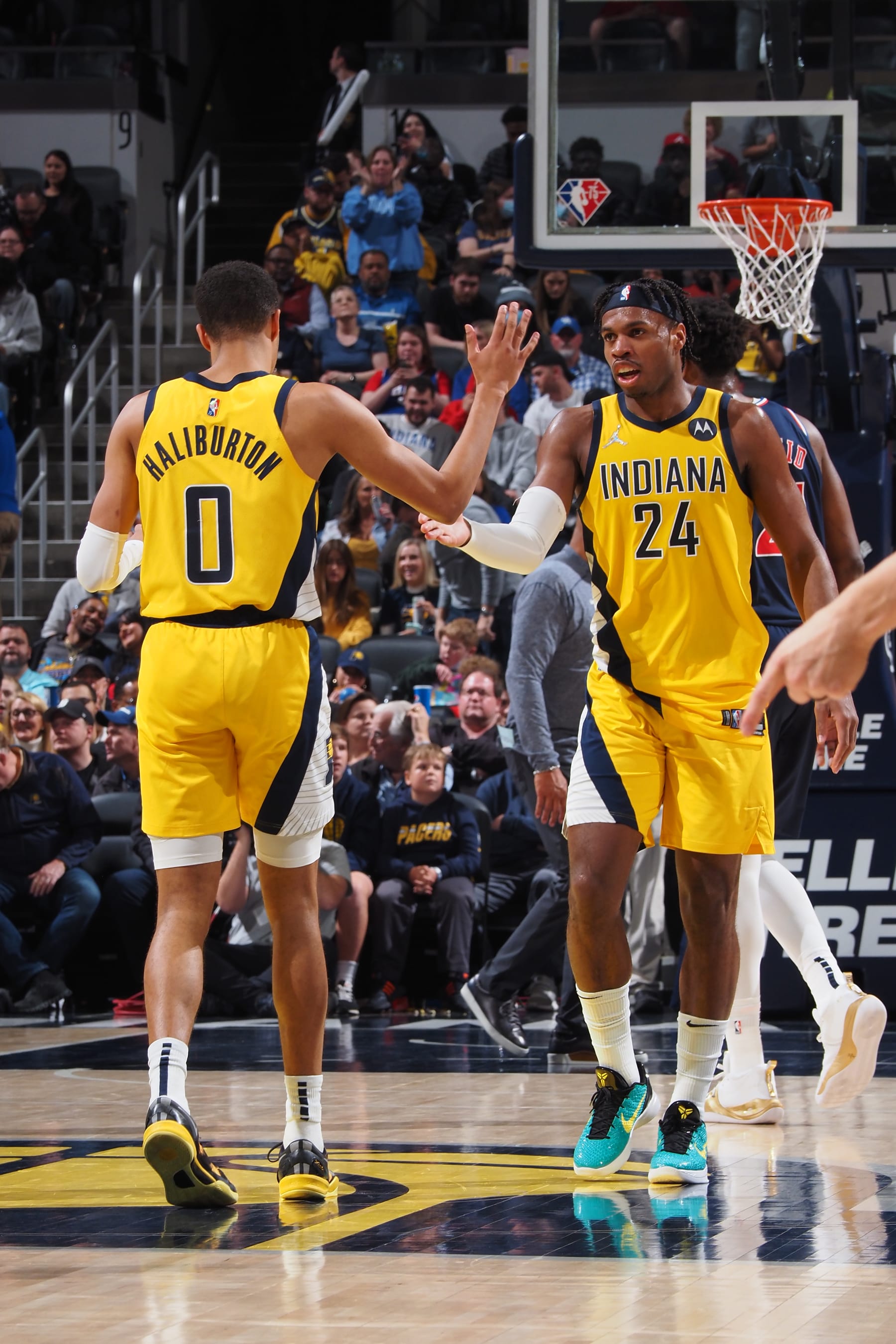 INDIANAPOLIS, IN - APRIL 5: Tyrese Haliburton #0 of the Indiana Pacers high fives Buddy Hield #24 of the Indiana Pacers during the game against the Philadelphia 76ers on April 5, 2022 at Gainbridge Fieldhouse in Indianapolis, Indiana. NOTE TO USER: User expressly acknowledges and agrees that, by downloading and or using this Photograph, user is consenting to the terms and conditions of the Getty Images License Agreement. Mandatory Copyright Notice: Copyright 2022 NBAE (Photo by Ron Hoskins/NBAE via Getty Images)
