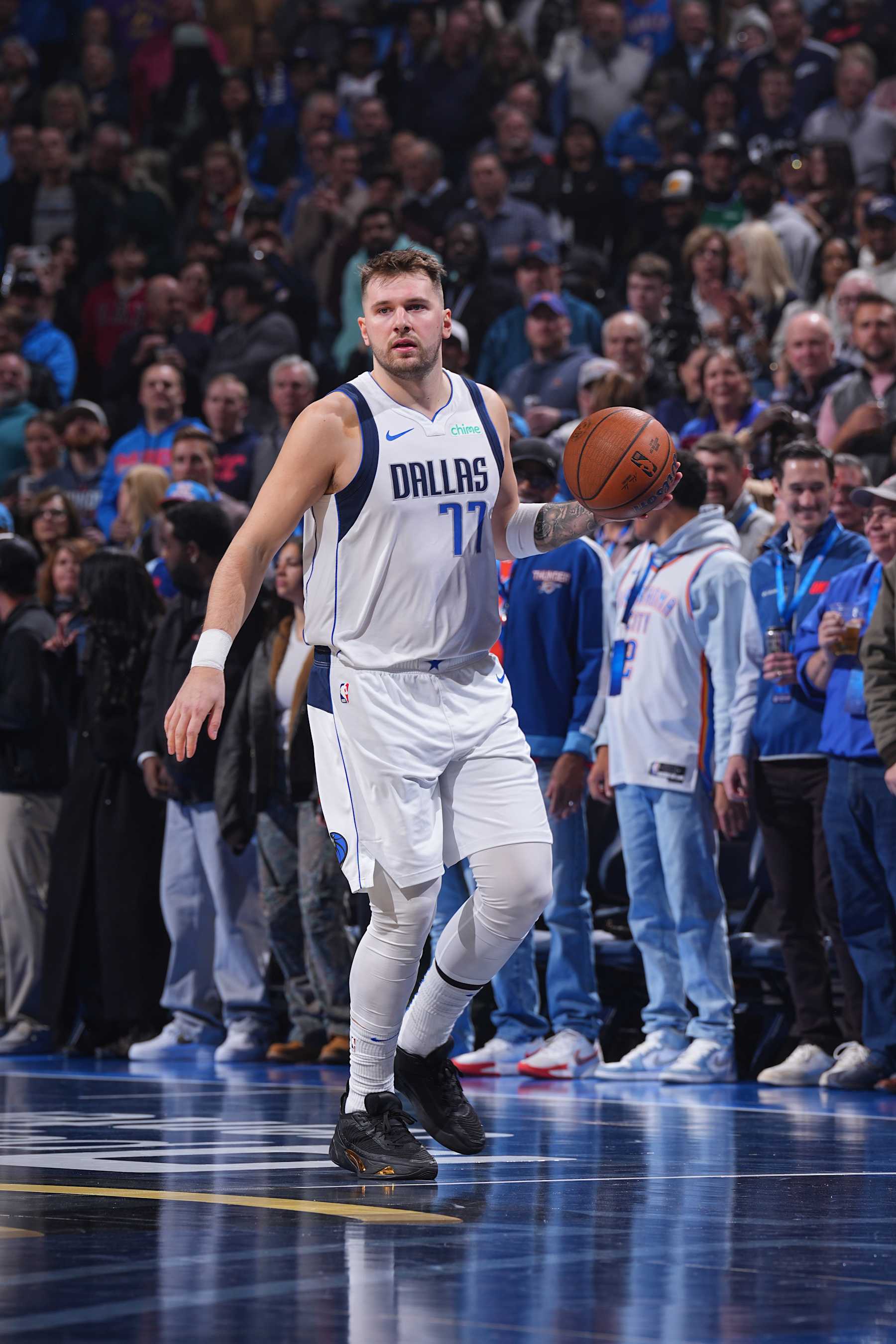 OKLAHOMA CITY, OK - DECEMBER 10: Luka Doncic #77 of the Dallas Mavericks dribbles the ball during the game against the Oklahoma City Thunder during the Emirates NBA Cup Quarterfinals on December 10, 2024 at Paycom Center in Oklahoma City, Oklahoma. NOTE TO USER: User expressly acknowledges and agrees that, by downloading and or using this photograph, User is consenting to the terms and conditions of the Getty Images License Agreement. Mandatory Copyright Notice: Copyright 2024 NBAE (Photo by Garrett Ellwood/NBAE via Getty Images)