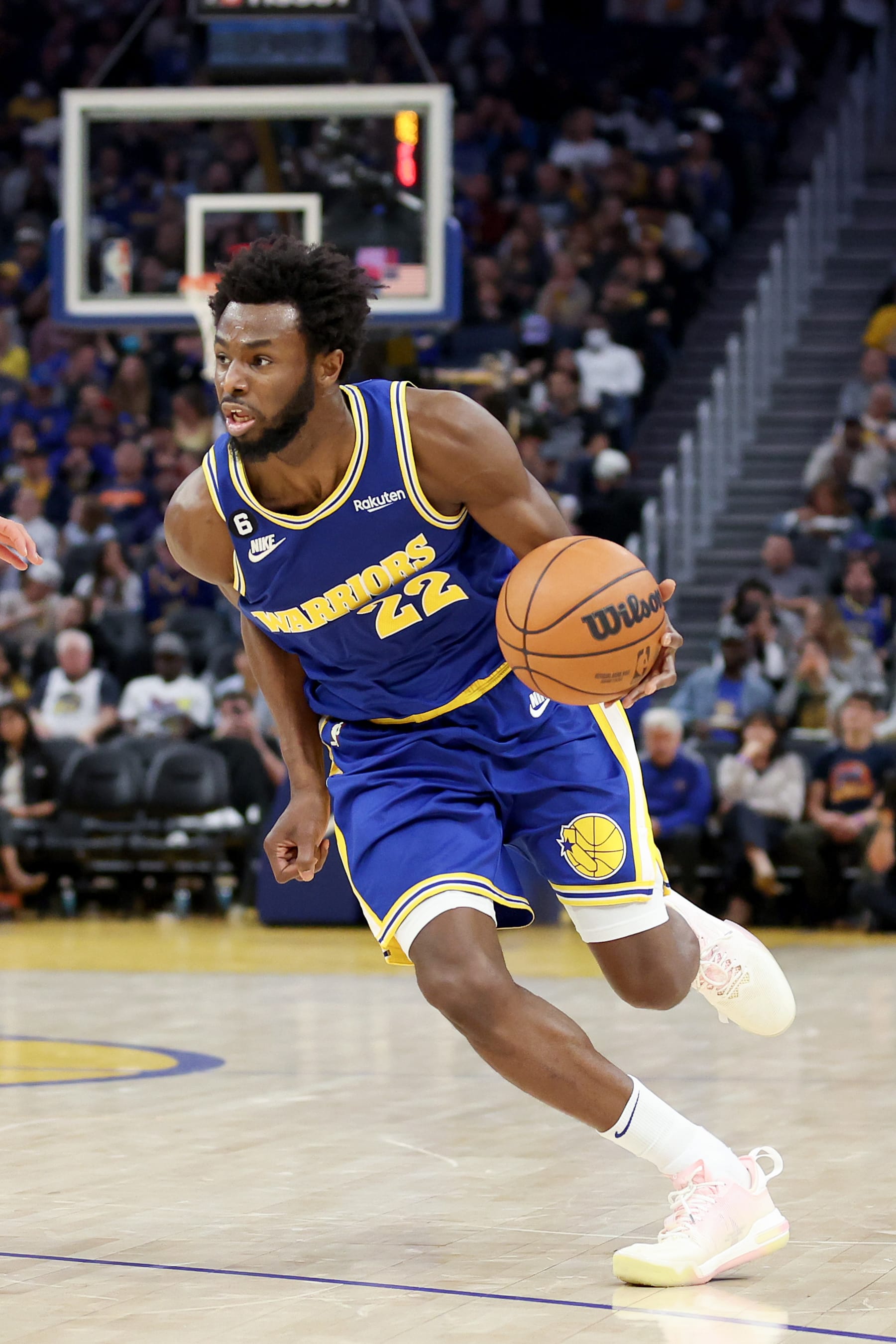 SAN FRANCISCO, CALIFORNIA - OCTOBER 21: Andrew Wiggins #22 of the Golden State Warriors dribbles the ball against the Denver Nuggets at Chase Center on October 21, 2022 in San Francisco, California. NOTE TO USER: User expressly acknowledges and agrees that, by downloading and or using this photograph, User is consenting to the terms and conditions of the Getty Images License Agreement.  (Photo by Ezra Shaw/Getty Images)