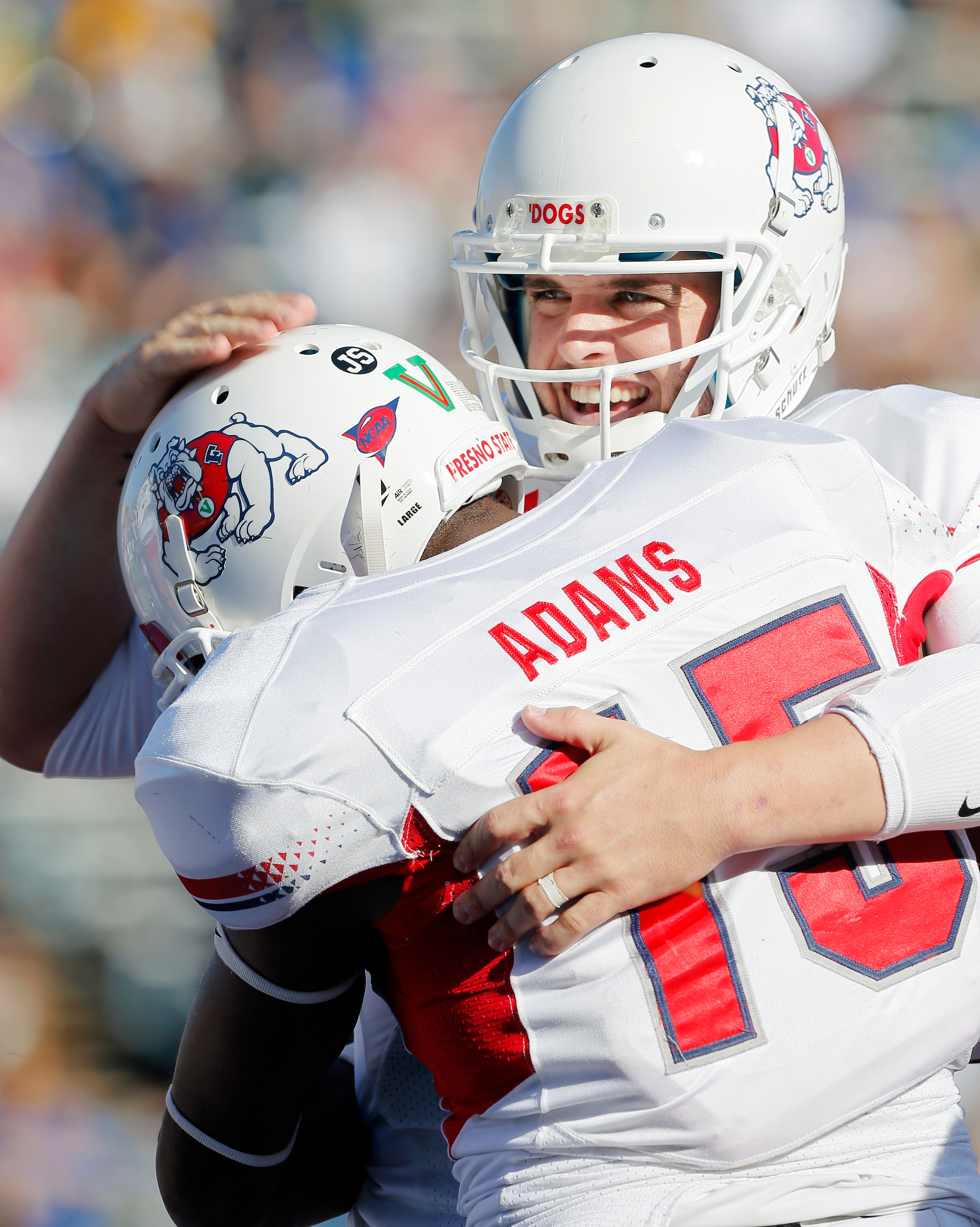 SAN JOSE, CA - NOVEMBER 29: Quarterback Derek Carr #4 of the Fresno State Bulldogs celebrates a touchdown pass with wide receiver Davante Adams #15 against the San Jose State Spartans in the first half on November 29, 2013 at Spartan Stadium in San Jose, California.  (Photo by Brian Bahr/Getty Images)