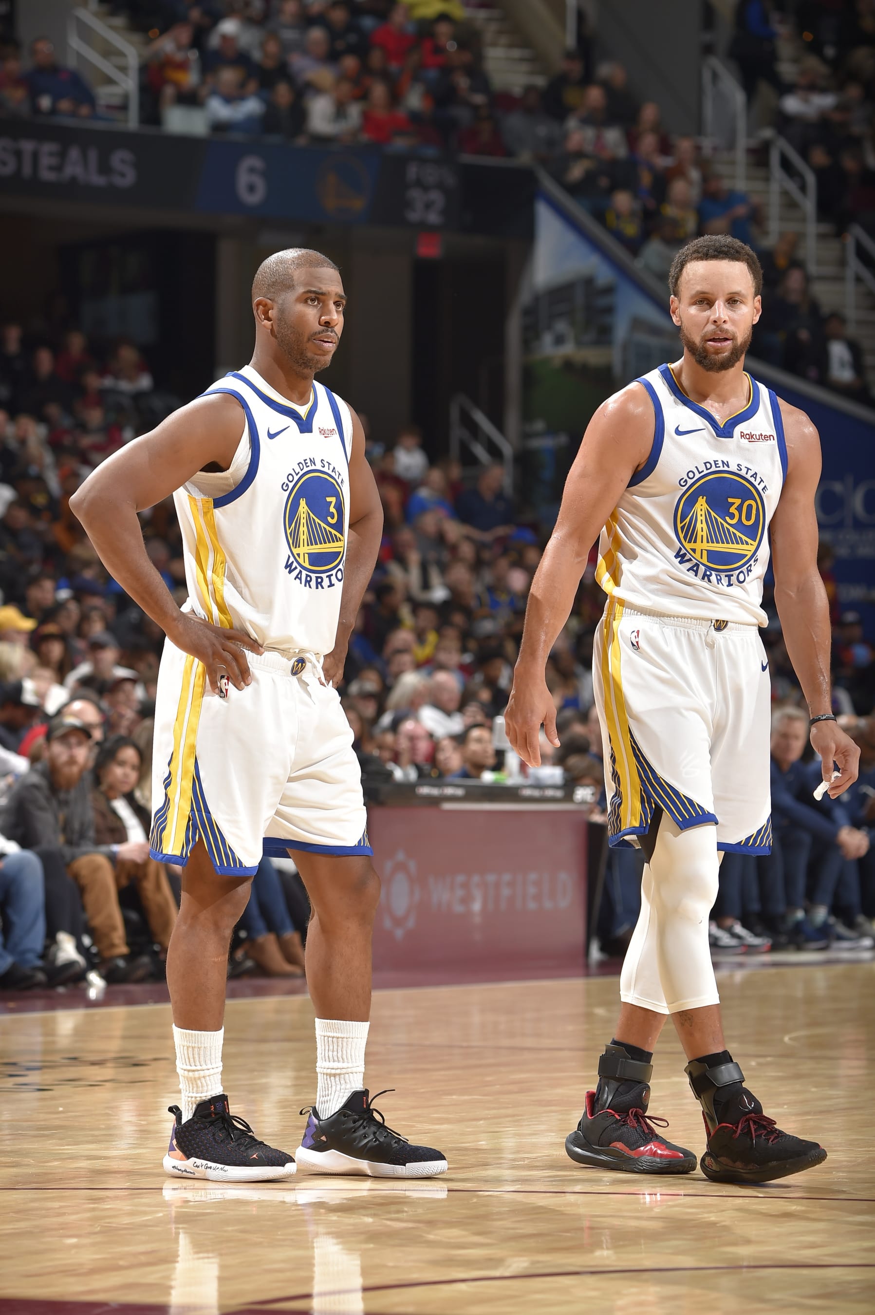 CLEVELAND, OH - NOVEMBER 5: Chris Paul #3 and Stephen Curry #30 of the Golden State Warriors look on during the game against the Cleveland Cavaliers on November 5, 2023 at Rocket Mortgage FieldHouse in Cleveland, Ohio. NOTE TO USER: User expressly acknowledges and agrees that, by downloading and/or using this Photograph, user is consenting to the terms and conditions of the Getty Images License Agreement. Mandatory Copyright Notice: Copyright 2023 NBAE (Photo by David Liam Kyle/NBAE via Getty Images)