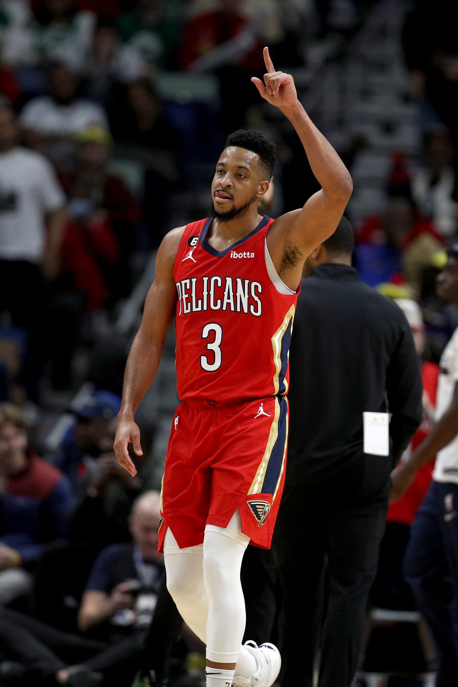 NEW ORLEANS, LOUISIANA - NOVEMBER 18: CJ McCollum #3 of the New Orleans Pelicans  reacts after scoring a three point basket during the second quarter of an NBA game against the Boston Celtics at Smoothie King Center on November 18, 2022 in New Orleans, Louisiana. NOTE TO USER: User expressly acknowledges and agrees that, by downloading and or using this photograph, User is consenting to the terms and conditions of the Getty Images License Agreement. (Photo by Sean Gardner/Getty Images)