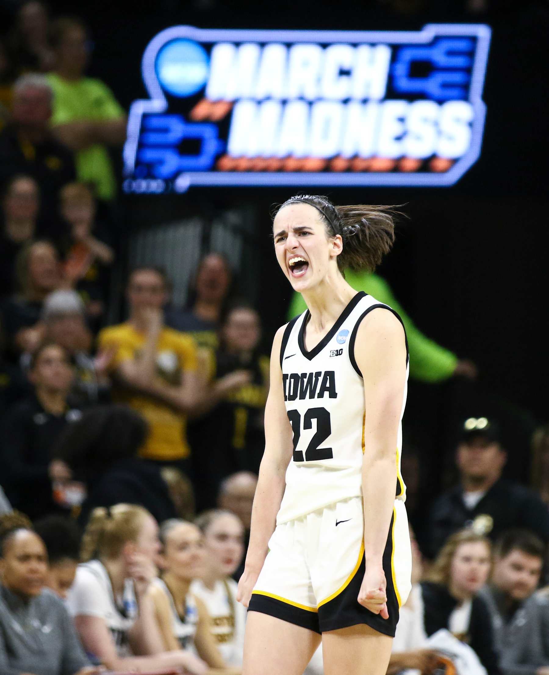 IOWA CITY, IOWA- MARCH 25:  Guard Caitlin Clark #22 of the Iowa Hawkeyes celebrates after drawing a foul late in the second half against the West Virginia Mountaineers during their second round match-up in the 2024 NCAA Division 1 Womens Basketball Championship at Carver-Hawkeye Arena on March 25, 2024 in Iowa City, Iowa.  (Photo by Matthew Holst/Getty Images)