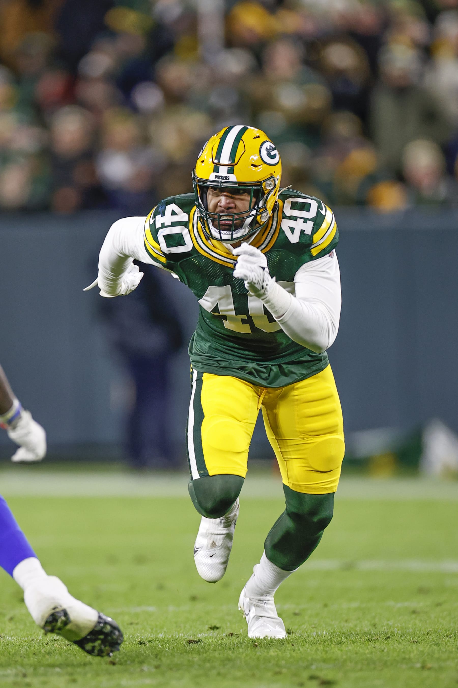 Green Bay Packers line backer Tipa Galeai (40) runs on the field during the second half of an NFL football game against the Los Angeles Rams, Sunday, Nov. 28, 2021, in Green Bay, Wis. (AP Photo/Kamil Krzaczynski)