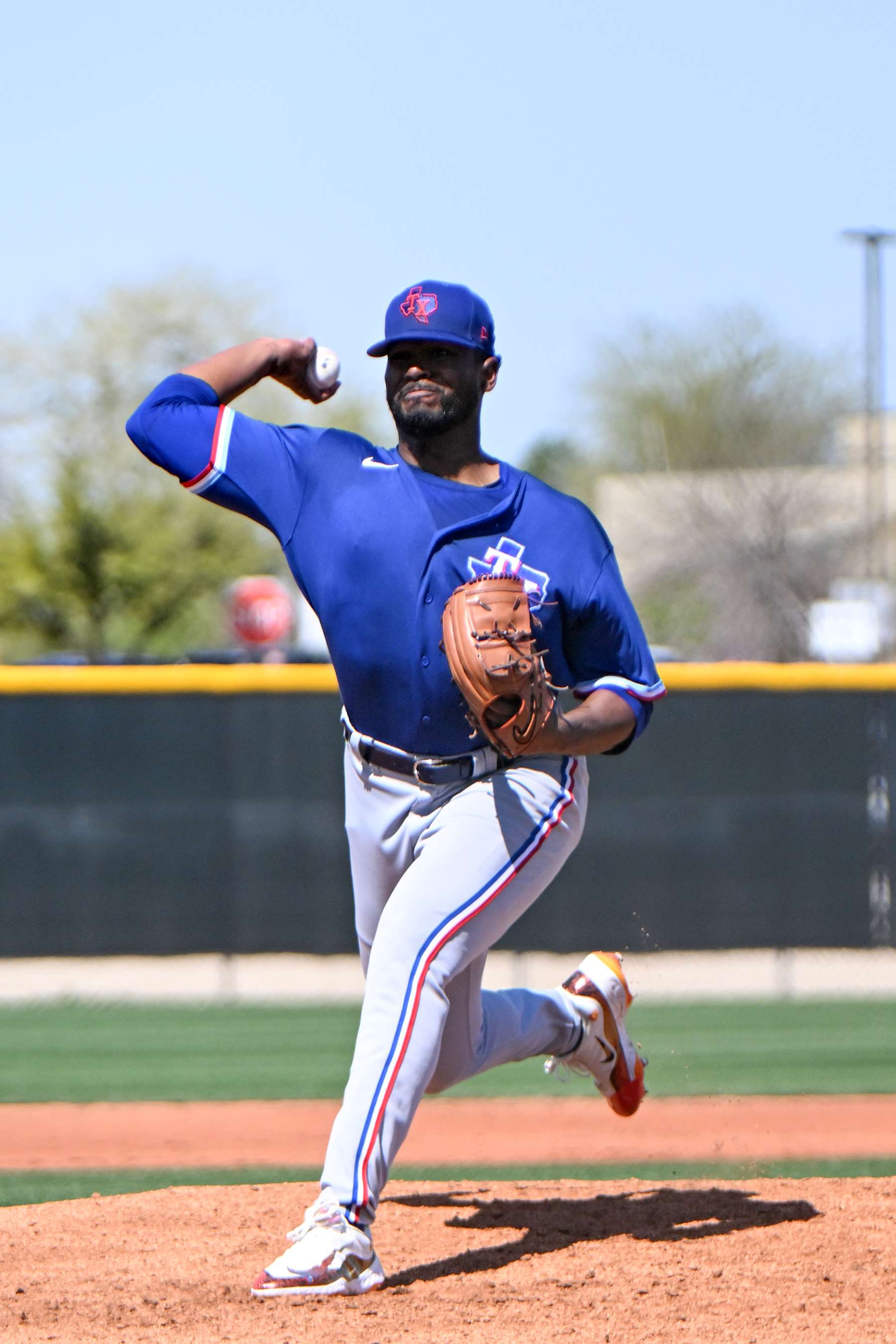 SURPRISE, ARIZONA - MARCH 25, 2023: Kumar Rocker #80 of the Texas Rangers throws a pitch during a minor league spring training game against the Kansas City Royals at Surprise Stadium on March 25, 2023 in Surprise, Arizona. (Photo by David Durochik/Diamond Images via Getty Images)