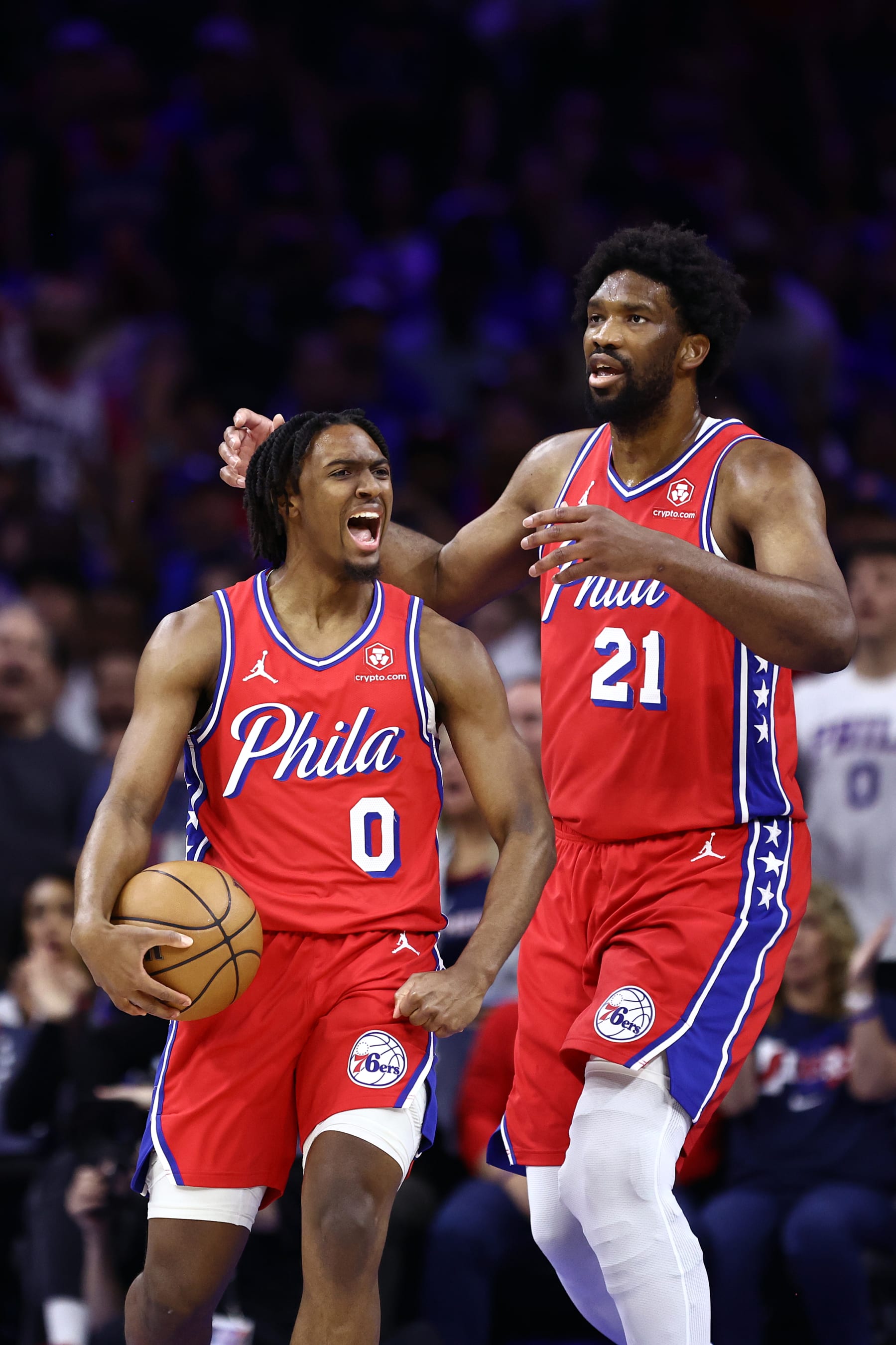 PHILADELPHIA, PENNSYLVANIA - APRIL 28: Tyrese Maxey #0 and Joel Embiid #21 of the Philadelphia 76ers react during the first quarter against the New York Knicks during game four of the Eastern Conference First Round Playoffs at the Wells Fargo Center on April 28, 2024 in Philadelphia, Pennsylvania. NOTE TO USER: User expressly acknowledges and agrees that, by downloading and/or using this Photograph, user is consenting to the terms and conditions of the Getty Images License Agreement. (Photo by Tim Nwachukwu/Getty Images)