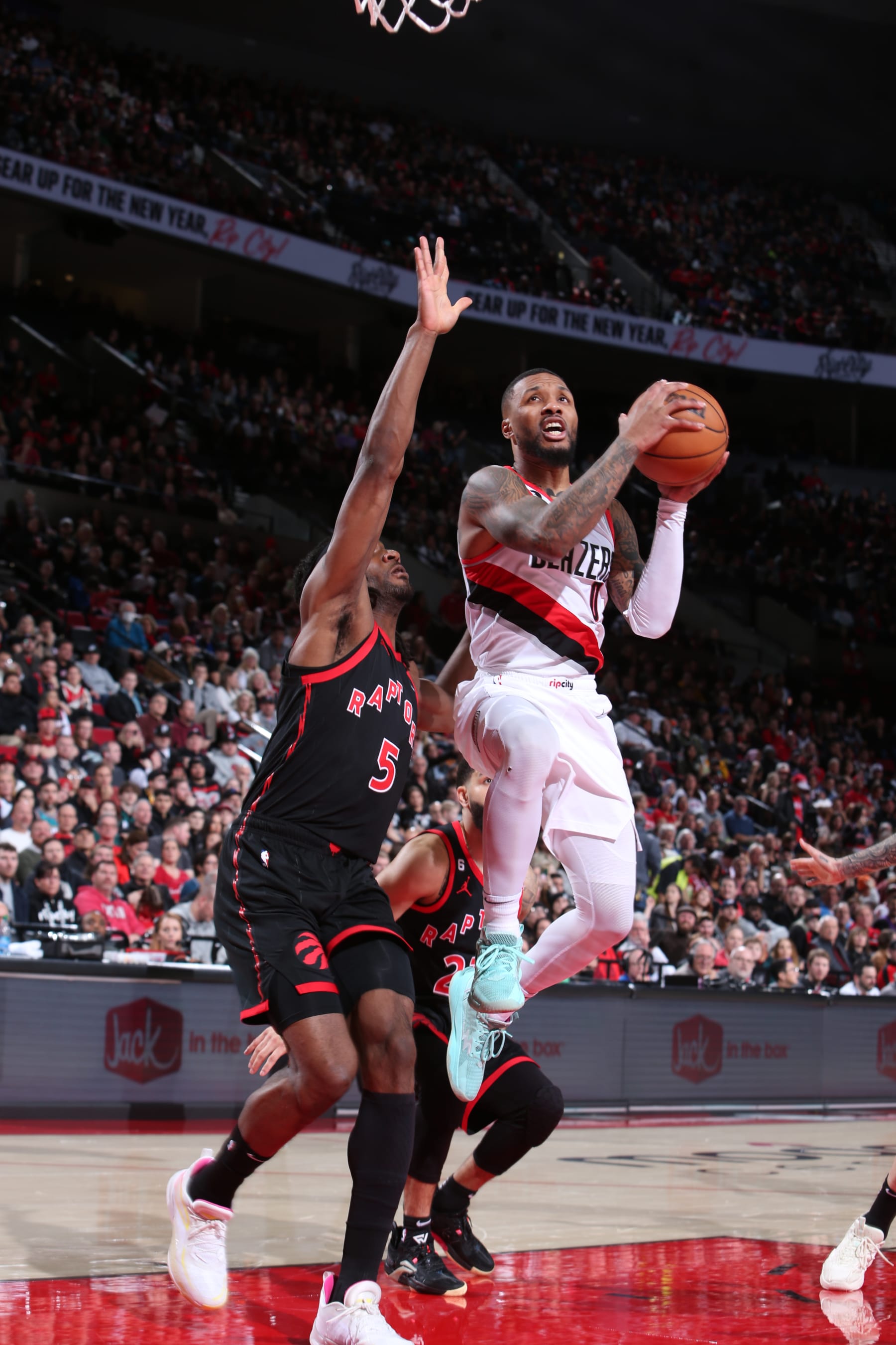 PORTLAND, OR - JANUARY 28: Damian Lillard #0 of the Portland Trail Blazers drives to the basket during the game against the Toronto Raptors on January 28, 2023 at the Moda Center Arena in Portland, Oregon. NOTE TO USER: User expressly acknowledges and agrees that, by downloading and or using this photograph, user is consenting to the terms and conditions of the Getty Images License Agreement. Mandatory Copyright Notice: Copyright 2023 NBAE (Photo by Sam Forencich/NBAE via Getty Images)