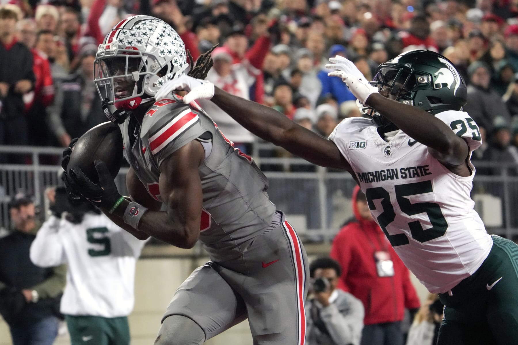 COLUMBUS, OH - NOVEMBER 11: Marvin Harrison Jr. #18 of the Ohio State Buckeyes catches a pass for a touchdown during the game against the Michigan State Spartans at Ohio Stadium in Columbus, Ohio on November 11, 2023. (Photo by Jason Mowry/Icon Sportswire via Getty Images)