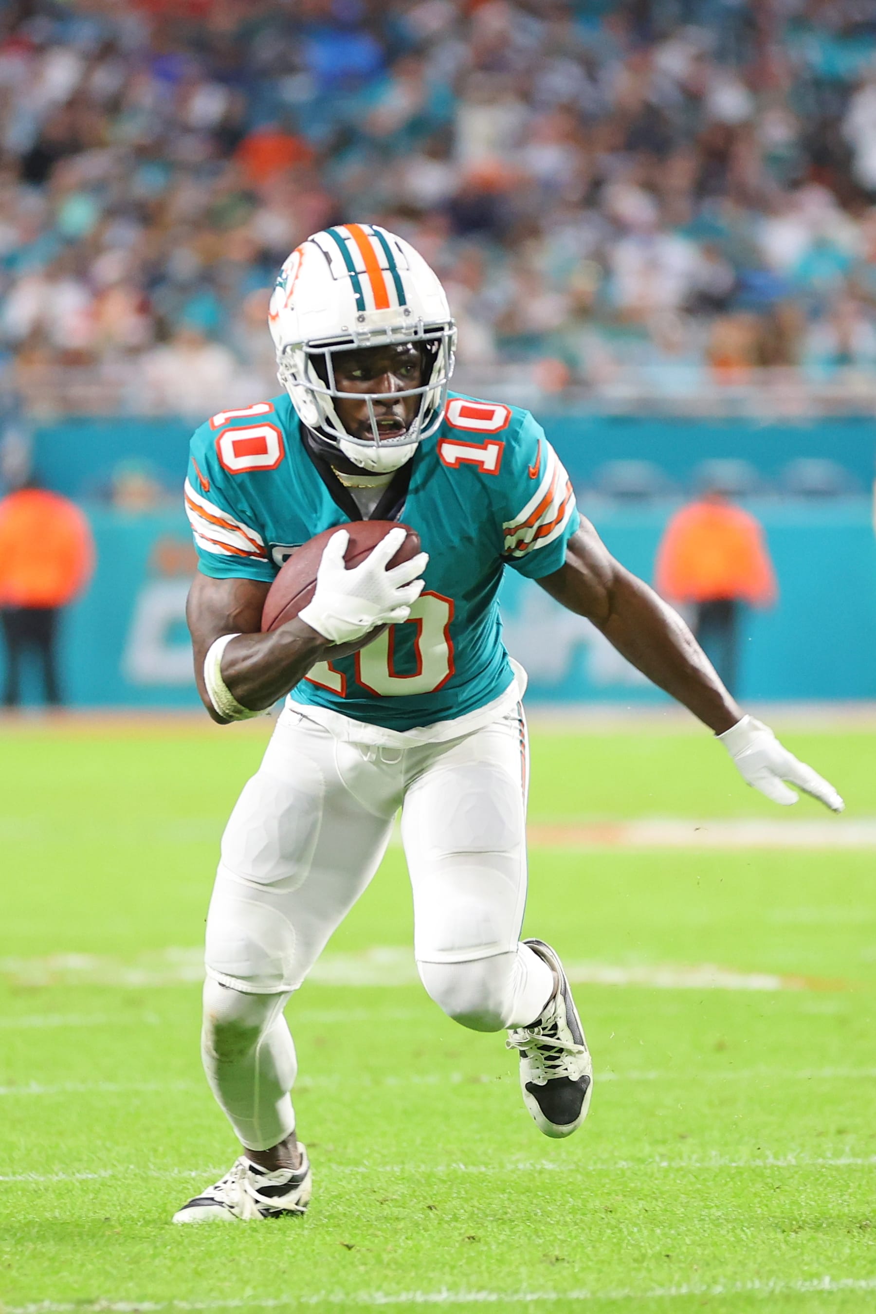 MIAMI GARDENS, FLORIDA - DECEMBER 24: Tyreek Hill #10 of the Miami Dolphins runs for yards during a game against the Dallas Cowboys at Hard Rock Stadium on December 24, 2023 in Miami Gardens, Florida.  The Dolphins defeated the Cowboys 22-20. (Photo by Stacy Revere/Getty Images)