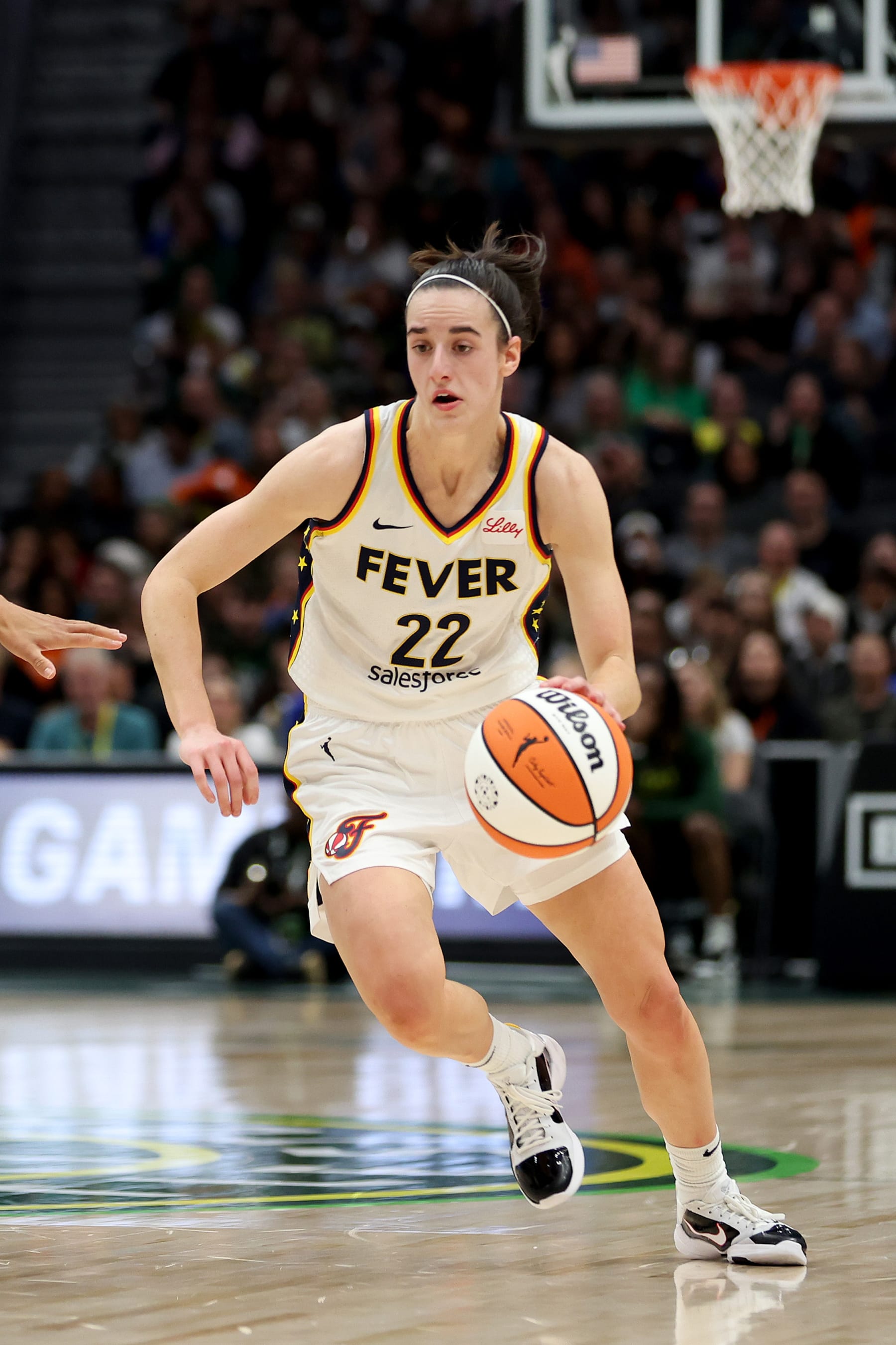 SEATTLE, WASHINGTON - MAY 22: Caitlin Clark #22 of the Indiana Fever dribbles against the Seattle Storm at Climate Pledge Arena on May 22, 2024 in Seattle, Washington. NOTE TO USER: User expressly acknowledges and agrees that, by downloading and or using this photograph, User is consenting to the terms and conditions of the Getty Images License Agreement. (Photo by Steph Chambers/Getty Images)