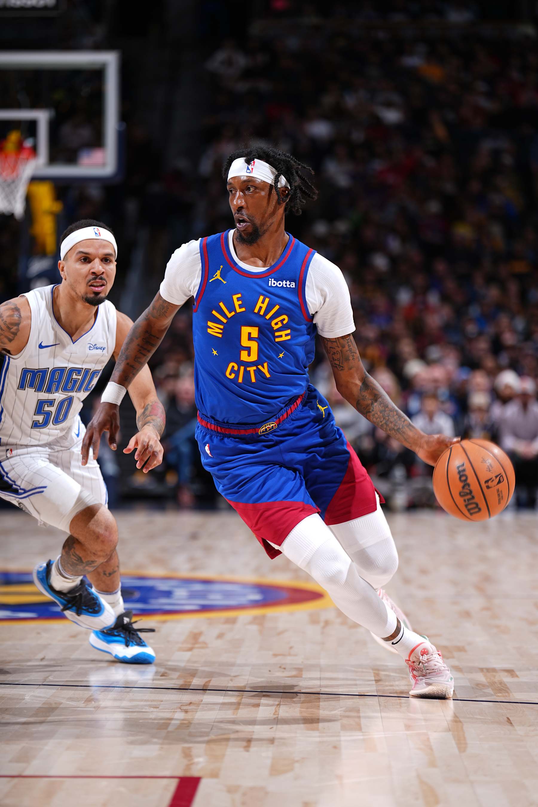 DENVER, CO - JANUARY 5: Kentavious Caldwell-Pope #5 of the Denver Nuggets drives to the basket during the game against the Orlando Magic on January 5, 2024 at the Ball Arena in Denver, Colorado. NOTE TO USER: User expressly acknowledges and agrees that, by downloading and/or using this Photograph, user is consenting to the terms and conditions of the Getty Images License Agreement. Mandatory Copyright Notice: Copyright 2024 NBAE (Photo by Garrett Ellwood/NBAE via Getty Images)