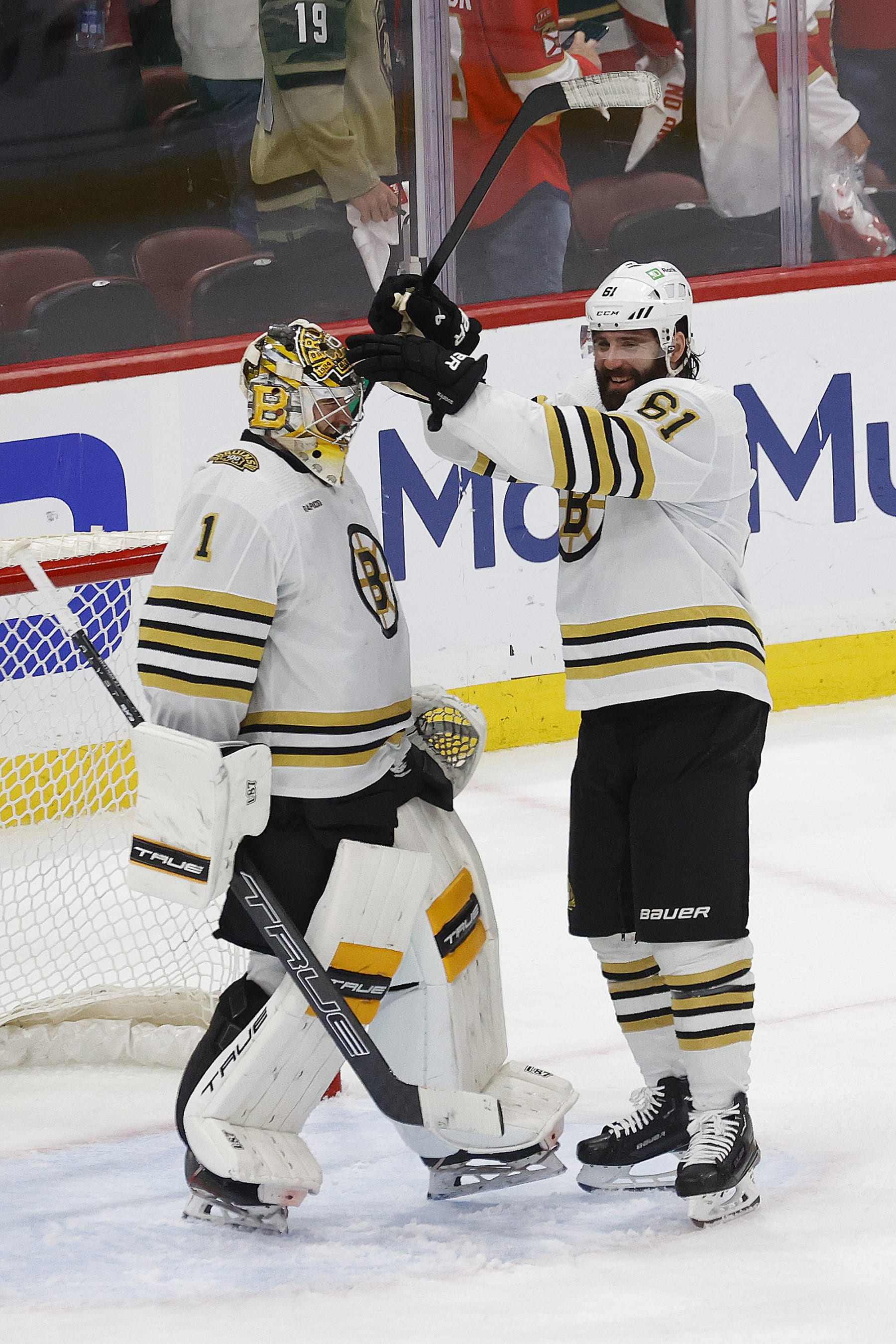SUNRISE, FLORIDA - MAY 14: Goaltender Jeremy Swayman #1 and Pat Maroon #61 of the Boston Bruins celebrate there 2-1 win over the Florida Panthers in Game Five of the Second Round of the 2024 Stanley Cup Playoffs at the Amerant Bank Arena on May 14, 2024 in Sunrise, Florida. (Photo by Eliot J. Schechter/NHLI via Getty Images)
