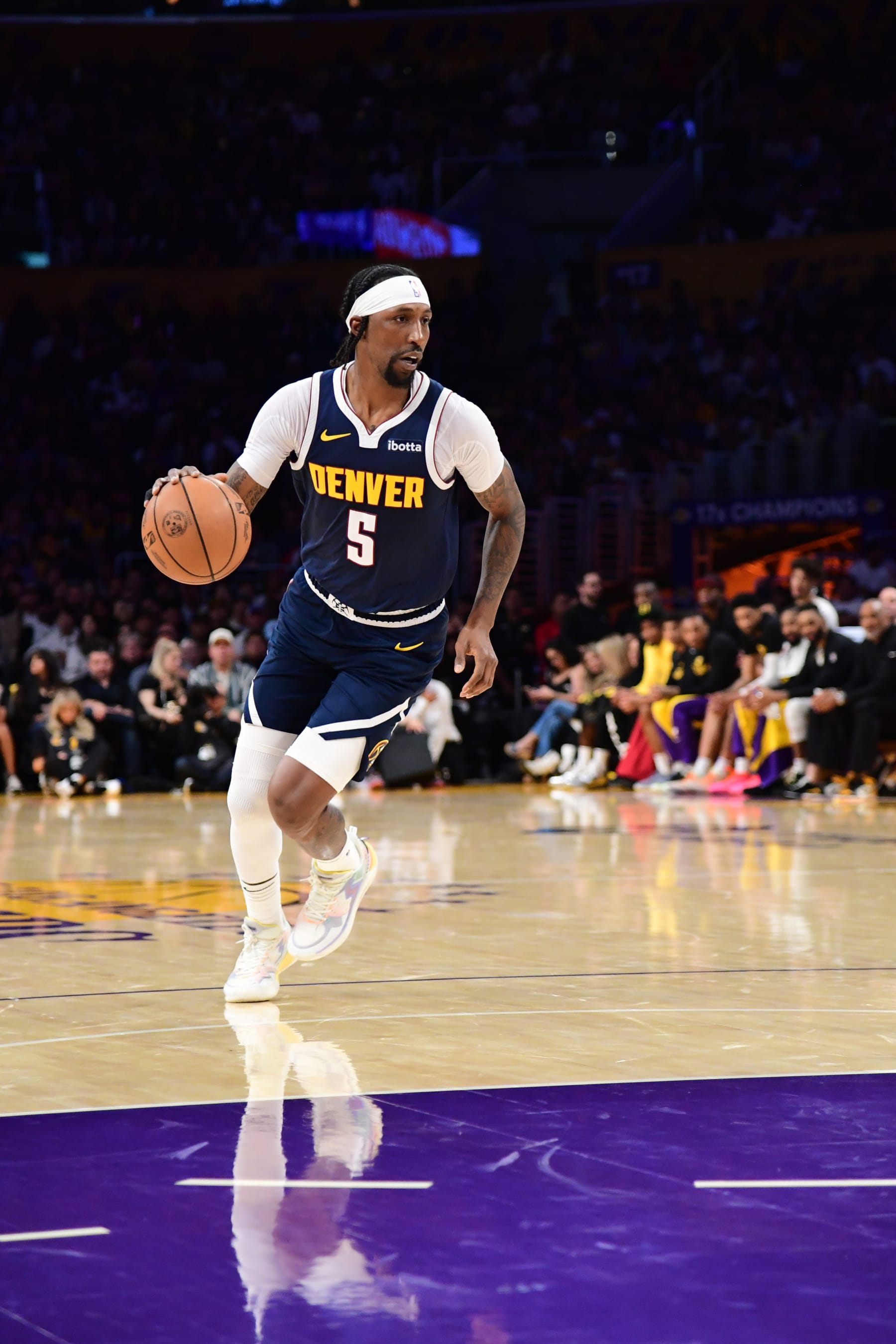 LOS ANGELES, CA - APRIL 27: Kentavious Caldwell-Pope #5 of the Denver Nuggets dribbles the ball during the game against the Los Angeles Lakers during Round 1 Game 4 of the 2024 NBA Playoffs on April 27, 2024 at Crypto.Com Arena in Los Angeles, California. NOTE TO USER: User expressly acknowledges and agrees that, by downloading and/or using this Photograph, user is consenting to the terms and conditions of the Getty Images License Agreement. Mandatory Copyright Notice: Copyright 2024 NBAE (Photo by Adam Pantozzi/NBAE via Getty Images)