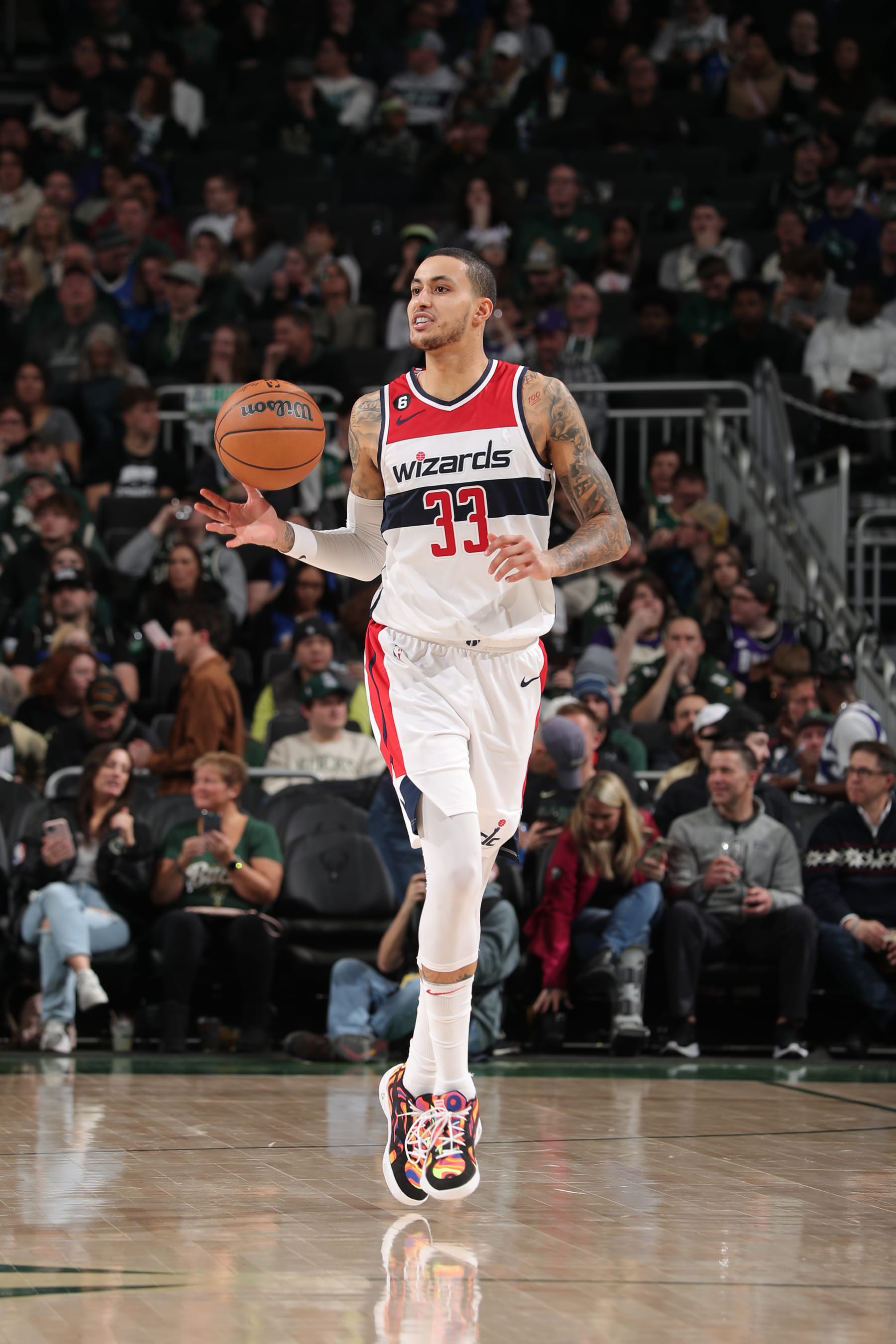 MILWAUKEE, WI - JANUARY 3: Kyle Kuzma #33 of the Washington Wizards dribbles the ball during the game against the Milwaukee Bucks on January 3, 2023 at the Fiserv Forum Center in Milwaukee, Wisconsin. NOTE TO USER: User expressly acknowledges and agrees that, by downloading and or using this Photograph, user is consenting to the terms and conditions of the Getty Images License Agreement. Mandatory Copyright Notice: Copyright 2023 NBAE (Photo by Gary Dineen/NBAE via Getty Images).