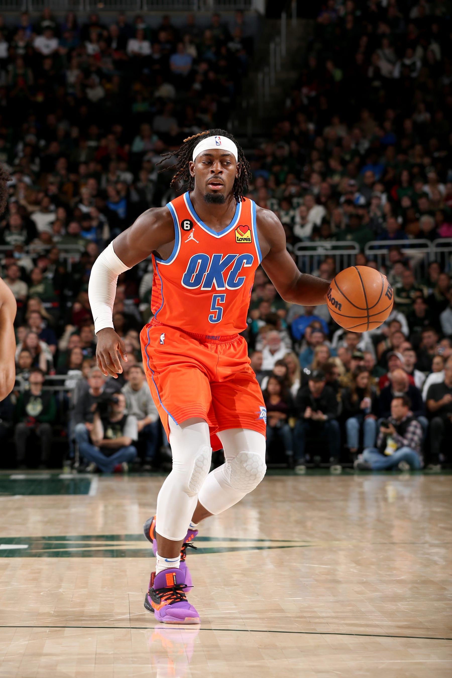 MILWAUKEE, WI - NOVEMBER 5: Luguentz Dort #5 of the Oklahoma City Thunder handles the ball against the Milwaukee Bucks  on November 5, 2022 at the Fiserv Forum Center in Milwaukee, Wisconsin. NOTE TO USER: User expressly acknowledges and agrees that, by downloading and or using this Photograph, user is consenting to the terms and conditions of the Getty Images License Agreement. Mandatory Copyright Notice: Copyright 2022 NBAE (Photo by Gary Dineen/NBAE via Getty Images).