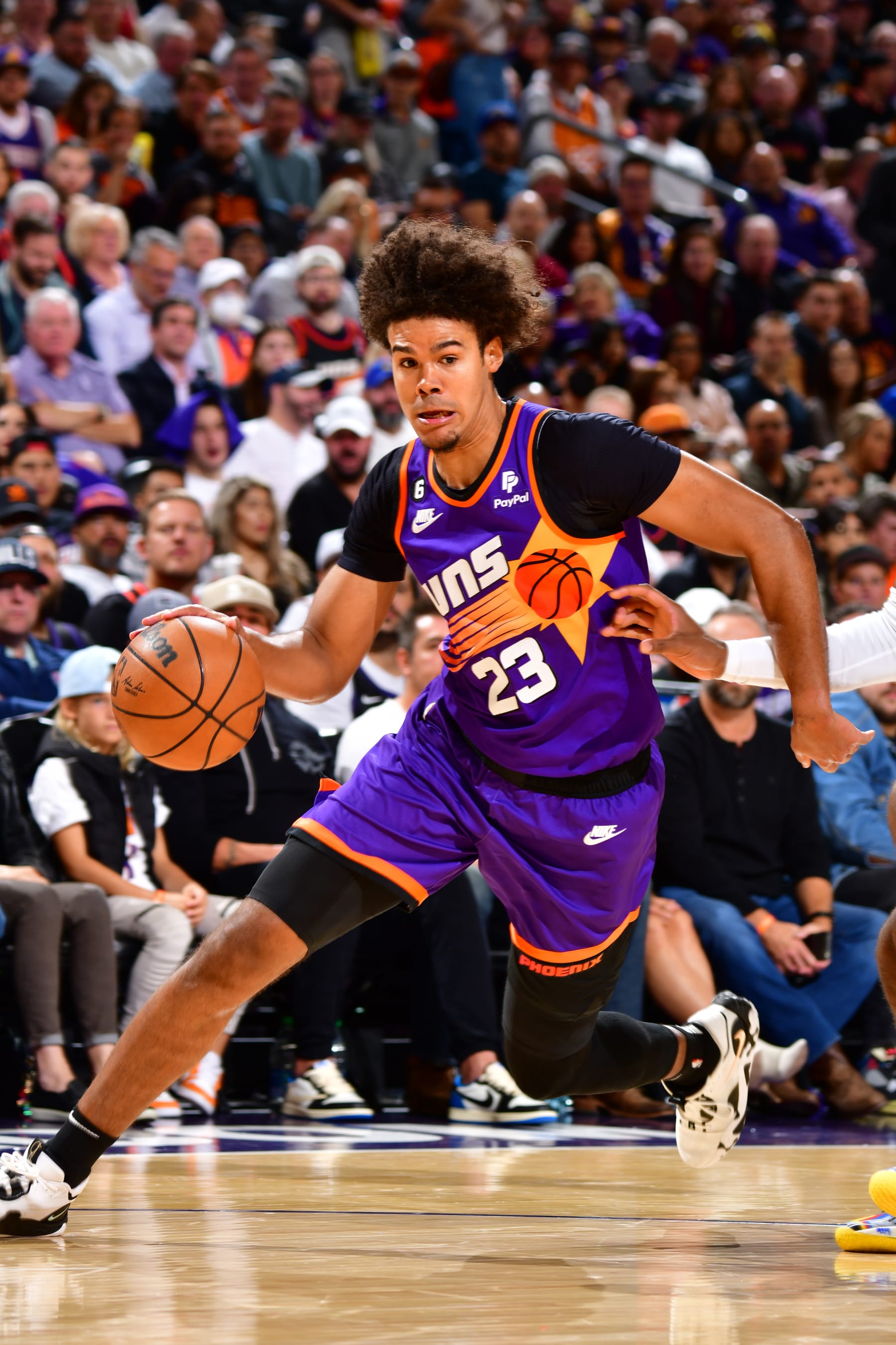 PHOENIX, AZ - OCTOBER 25: Cameron Johnson #23 of the Phoenix Suns drives to the basket during the game against the Golden State Warriors on October 25, 2022 at Footprint Center in Phoenix, Arizona. NOTE TO USER: User expressly acknowledges and agrees that, by downloading and or using this photograph, user is consenting to the terms and conditions of the Getty Images License Agreement. Mandatory Copyright Notice: Copyright 2022 NBAE (Photo by Barry Gossage/NBAE via Getty Images)