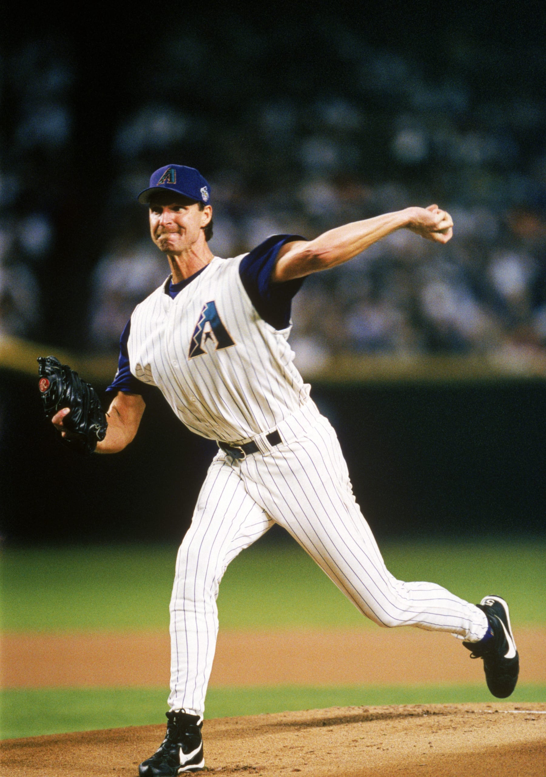 PHOENIX - NOVEMBER 4:  Randy Johnson of the Arizona Diamondbacks delivers a pitch during Game Six of the 2001 World Series against the New York Yankees at Bank One Ballpark on November 4, 2001 in the Phoenix, Arizona.  The Diamondbacks 15-2 and tie the series 3-3. (Photo by Rich Pilling/MLB via Getty Images)