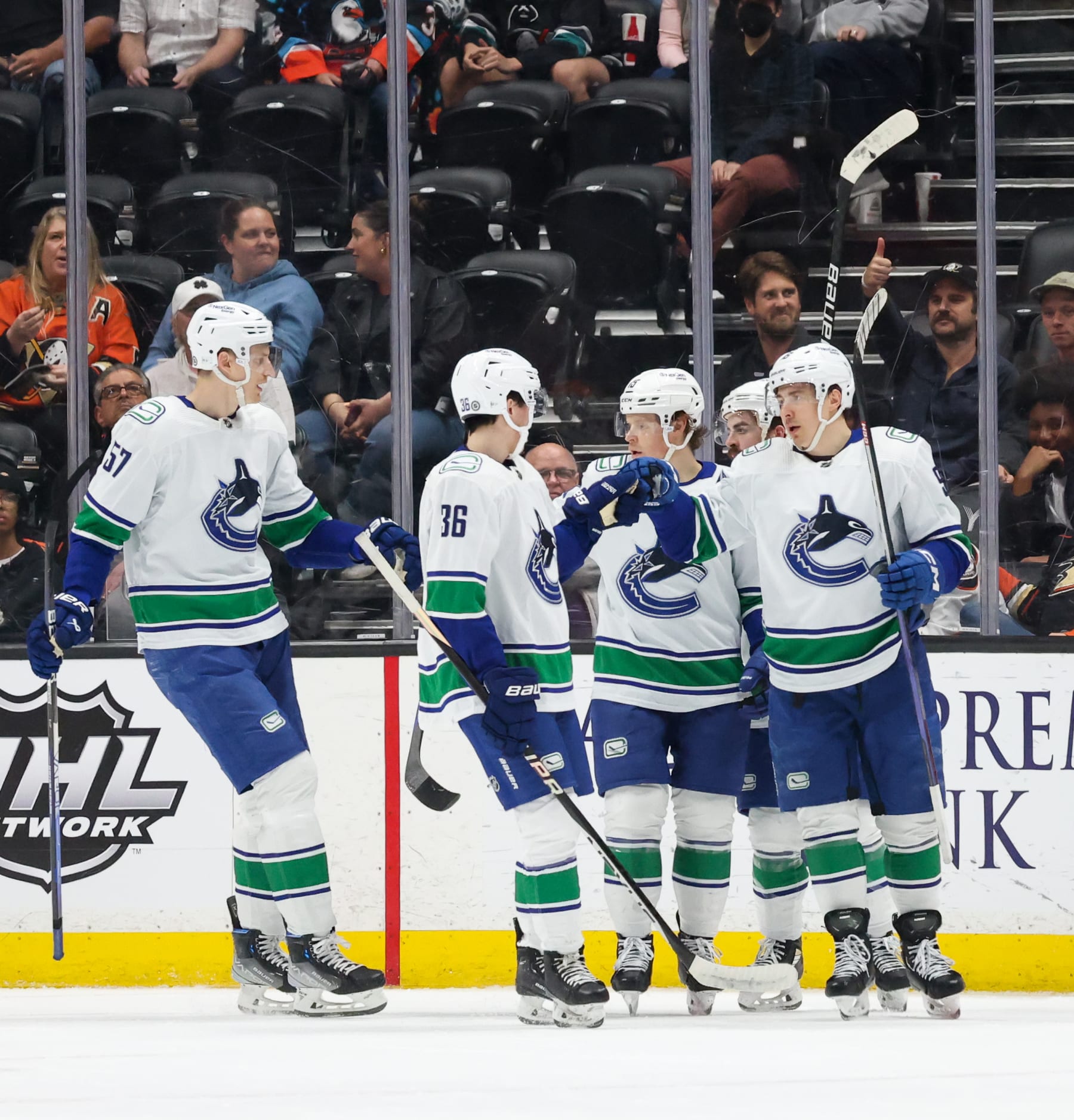 ANAHEIM, CA - APRIL 11:  Brock Boeser #6 of the Vancouver Canucks celebrates his goal with teammates during the first period against the Anaheim Ducks at Honda Center on April 11, 2023 in Anaheim, California. (Photo by Debora Robinson/NHLI via Getty Images)