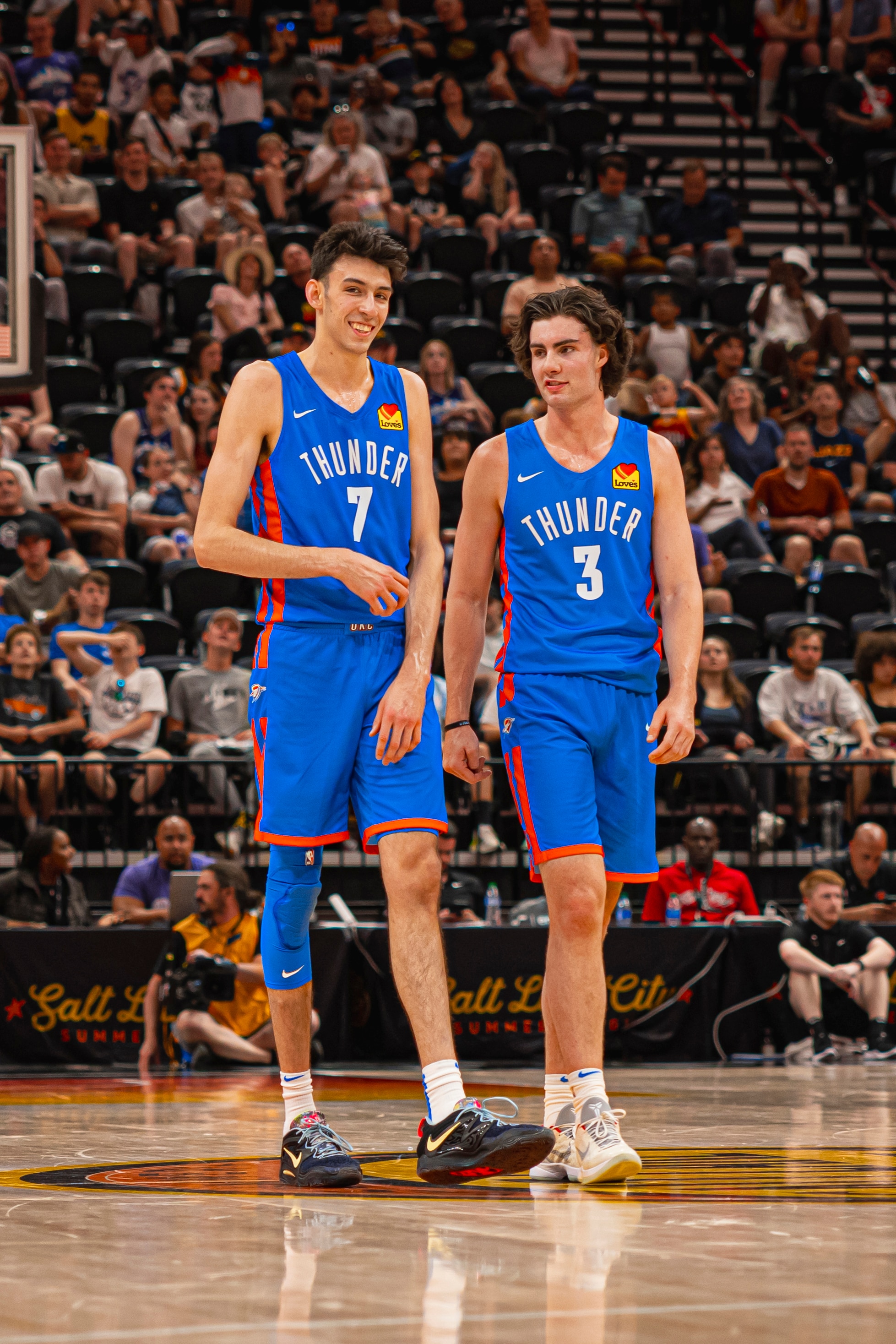 SALT LAKE CITY, UT - JULY 5: Chet Holmgren #7 and Josh Giddey #3 of the Oklahoma City Thunder look on during the 2022 NBA Salt Lake City Summer League against the Utah Jazz on July 5, 2022 at vivint.SmartHome Arena in Salt Lake City, Utah. NOTE TO USER: User expressly acknowledges and agrees that, by downloading and or using this Photograph, User is consenting to the terms and conditions of the Getty Images License Agreement. Mandatory Copyright Notice: Copyright 2022 NBAE (Photo by Zach Beeker/NBAE via Getty Images)