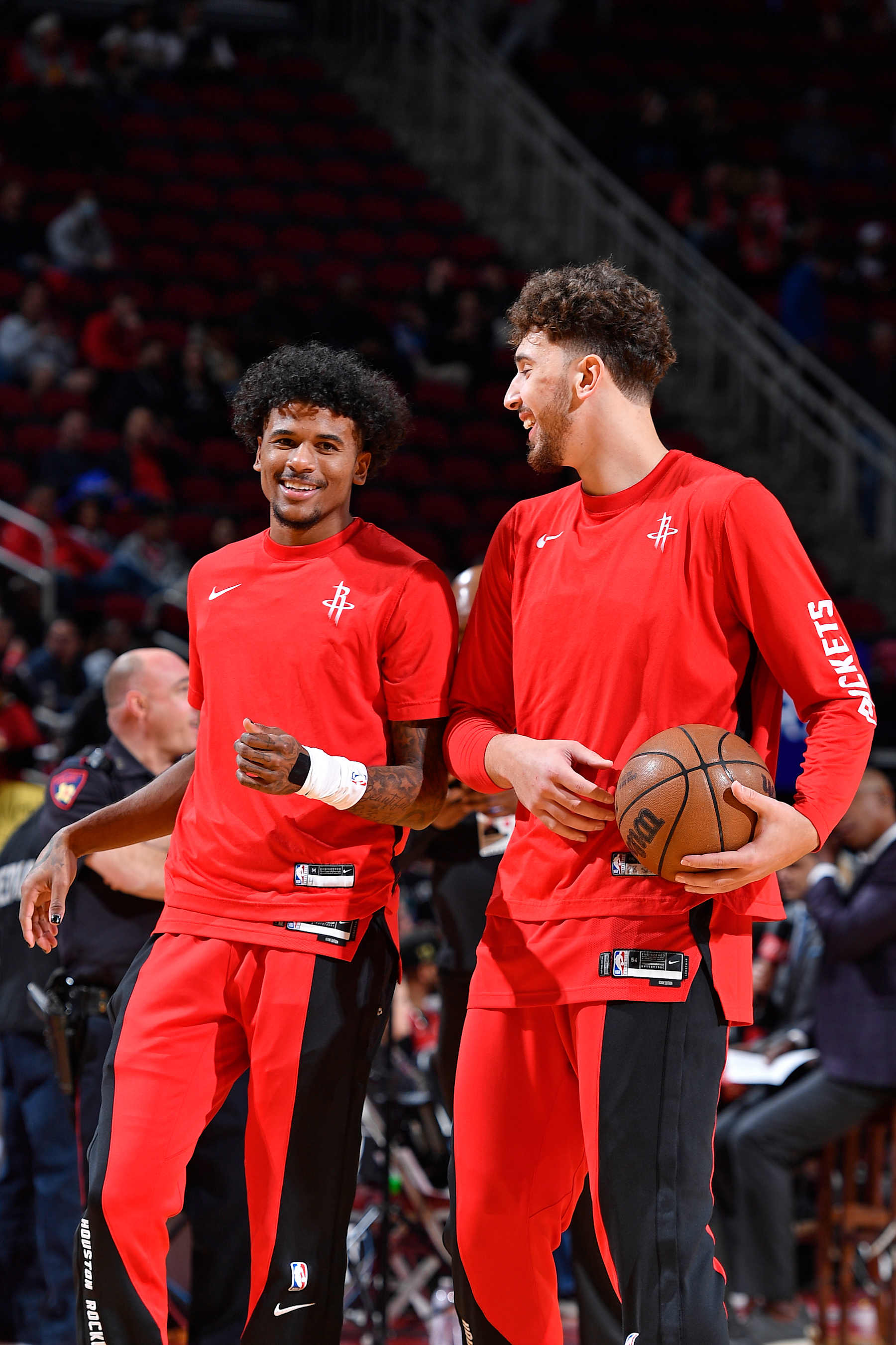 HOUSTON, TX - DECEMBER 11: Jalen Green #4 and Alperen Sengun #28 of the Houston Rockets smile before the game against the San Antonio Spurs on December 11, 2023 at the Toyota Center in Houston, Texas. NOTE TO USER: User expressly acknowledges and agrees that, by downloading and or using this photograph, User is consenting to the terms and conditions of the Getty Images License Agreement. Mandatory Copyright Notice: Copyright 2023 NBAE (Photo by Logan Riely/NBAE via Getty Images)