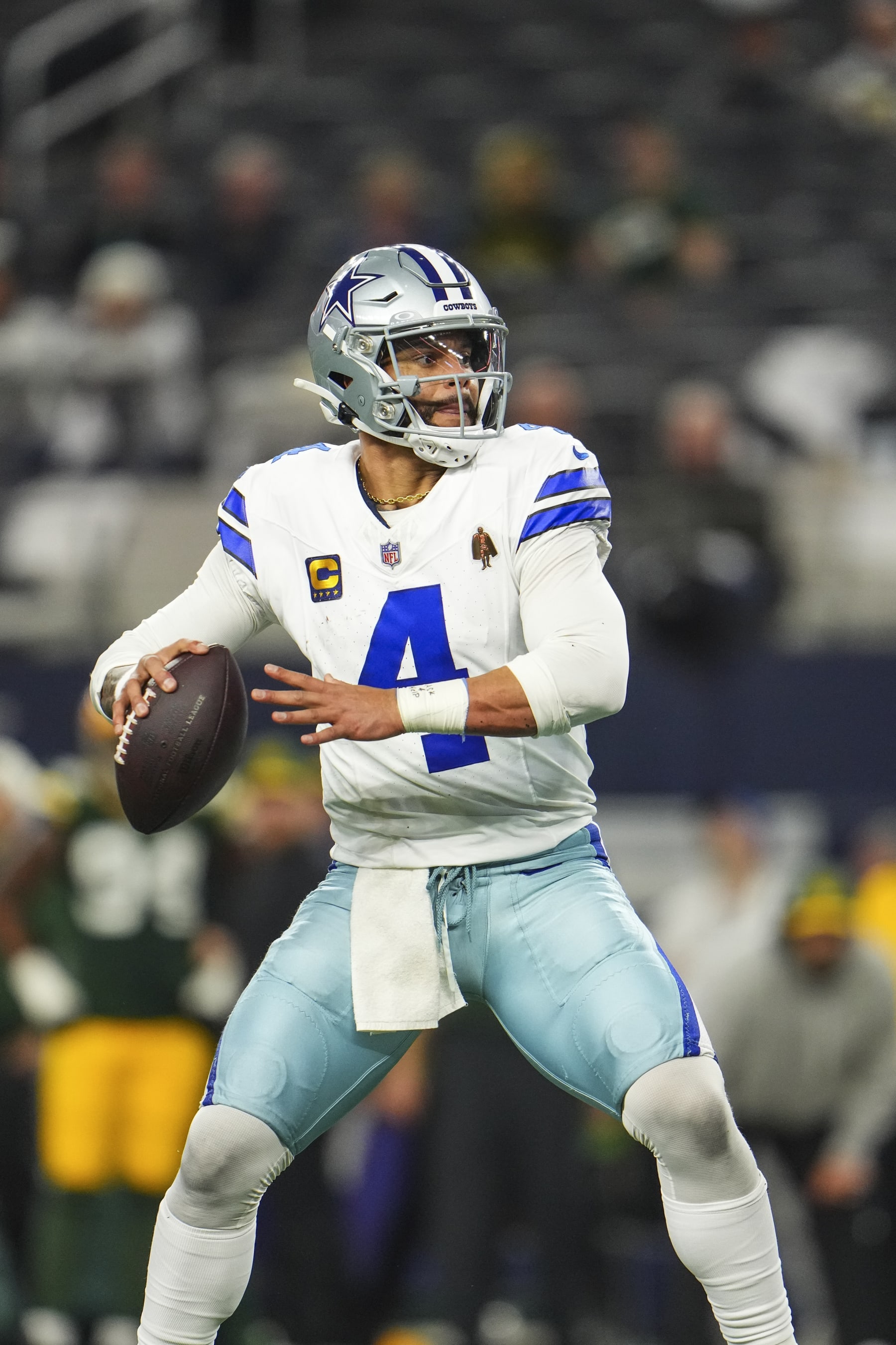 DALLAS, TX - JANUARY 14: Dak Prescott #4 of the Dallas Cowboys throws the ball during an NFL wild-card playoff football game against the Green Bay Packers at AT&T Stadium on January 14, 2024 in Dallas, Texas. (Photo by Cooper Neill/Getty Images)